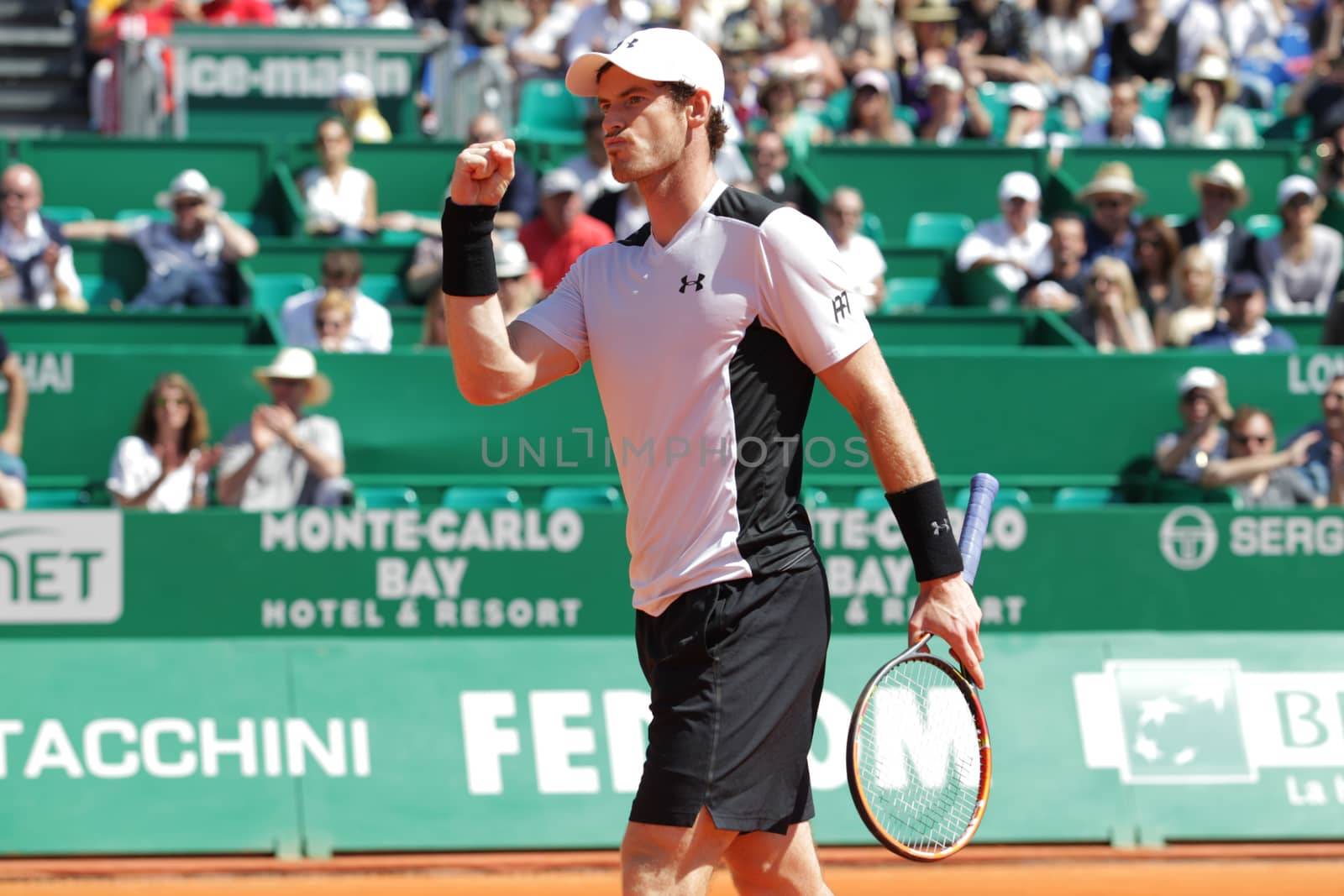 MONACO, Monte-Carlo: Britain's Andy Murray raises his fist in sign of victory during his  tennis match with Canada's Milos Raonic at the Monte-Carlo ATP Masters Series tournament on April 15, 2016 in Monaco. Britain's Andy Murray is through to the Monte Carlo Masters semi-finals following an impressive win over Canadian Milos Raonic.