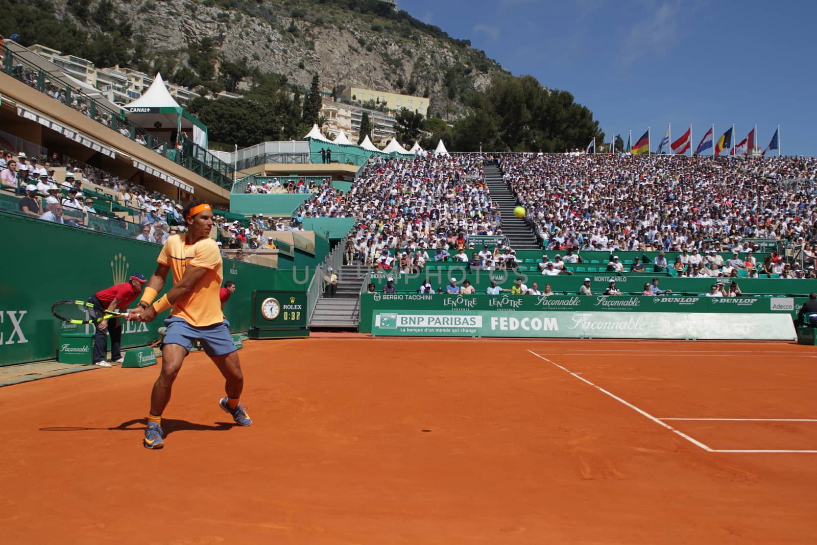 MONACO, Monte-Carlo: Spain's Rafael Nadal returns a shot to Switzerland's Stan Wawrinka during their tennis match at the Monte-Carlo ATP Masters Series tournament on April 15, 2016 in Monaco. 