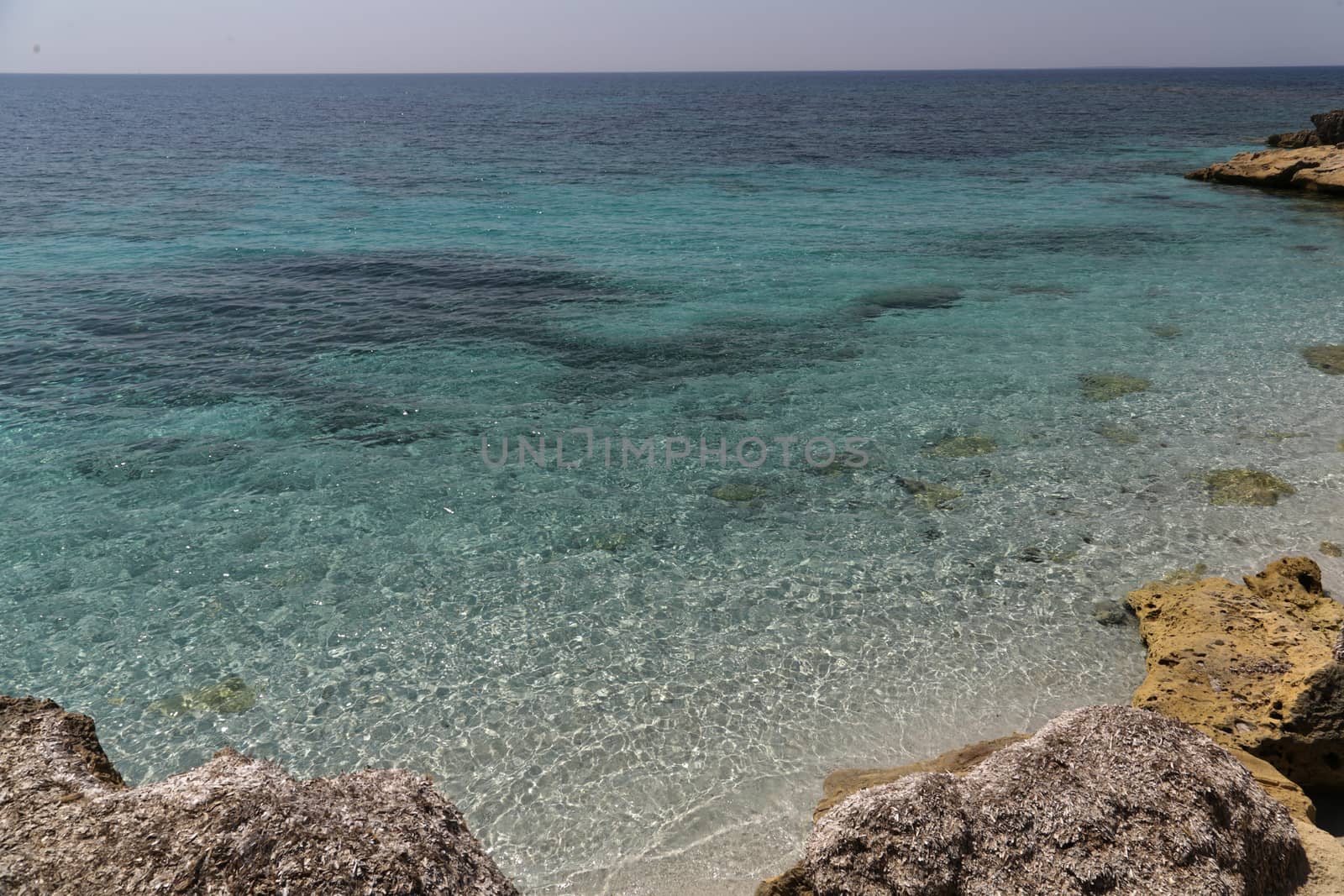 Beautiful turquoise sea water on coast of Is Arutas in Sardinia island, Italy