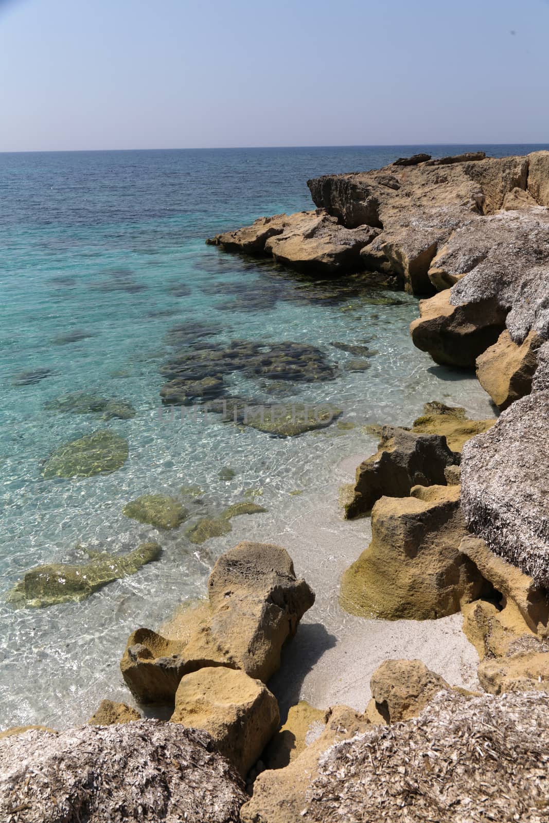 Beautiful turquoise sea water on coast of Is Arutas in Sardinia island, Italy