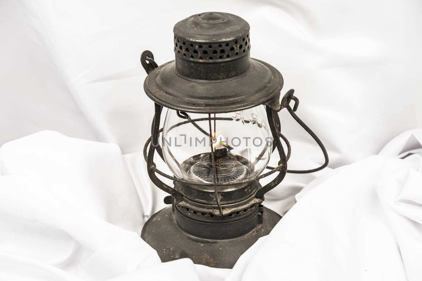 Old oil lantern isolated on white background