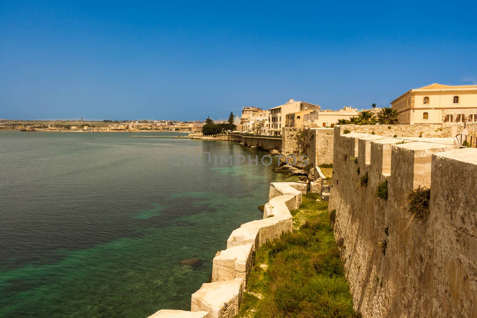 The city of Siracusa in Sicily, blue bay.