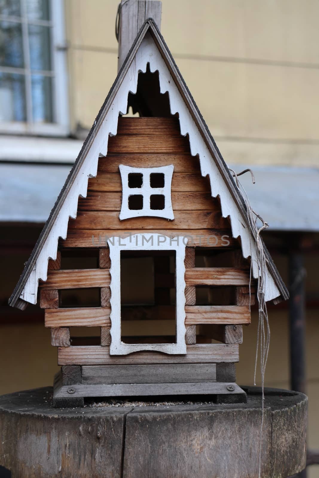 Small house birdhouse close to
