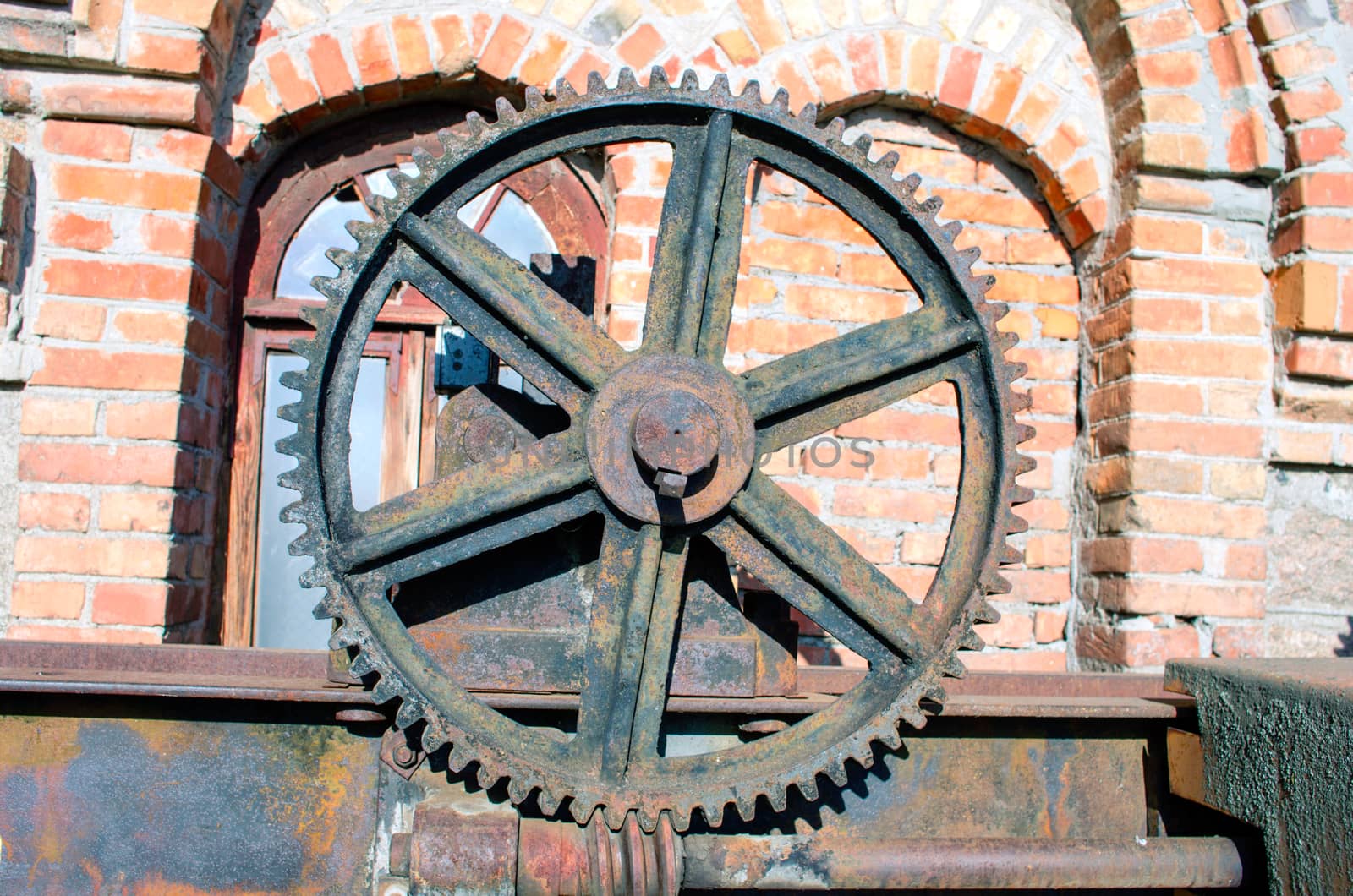 Old rusty gears, machinery parts.