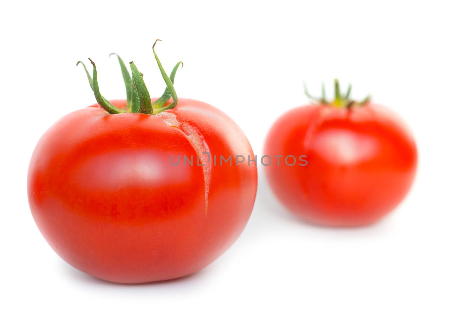 Two red fresh tomatoes by vapi