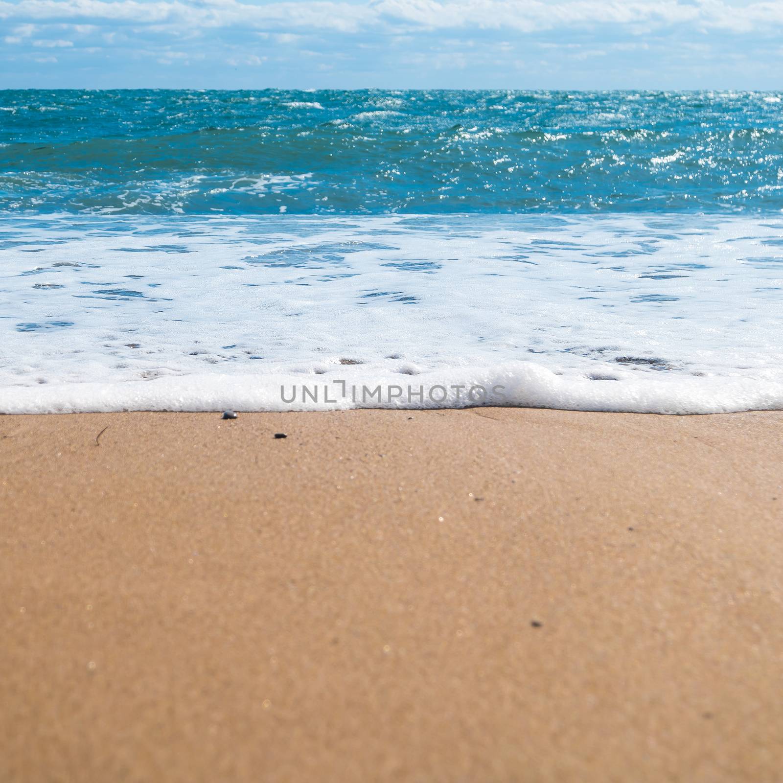 Blue sea and beach with golden sand. Summer vacation background