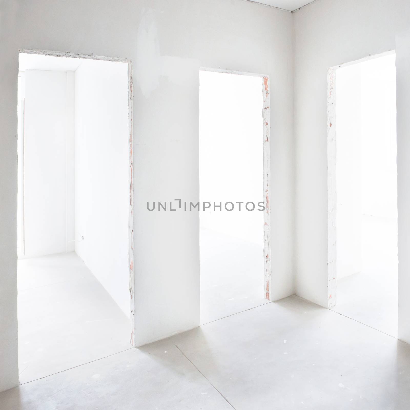 Three doors in white room by vapi