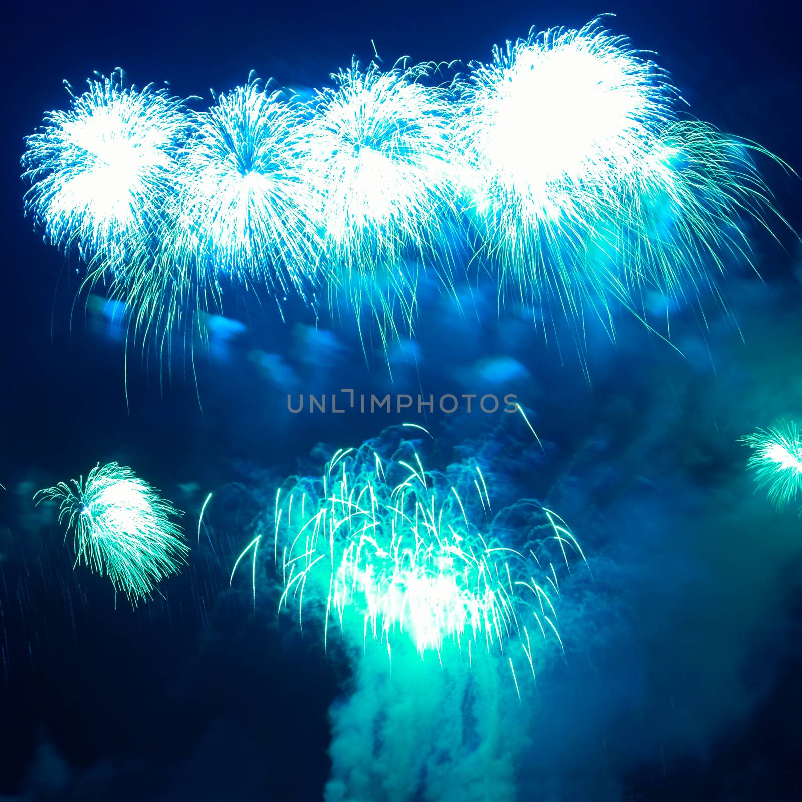 Colorful blue fireworks on the black sky background
