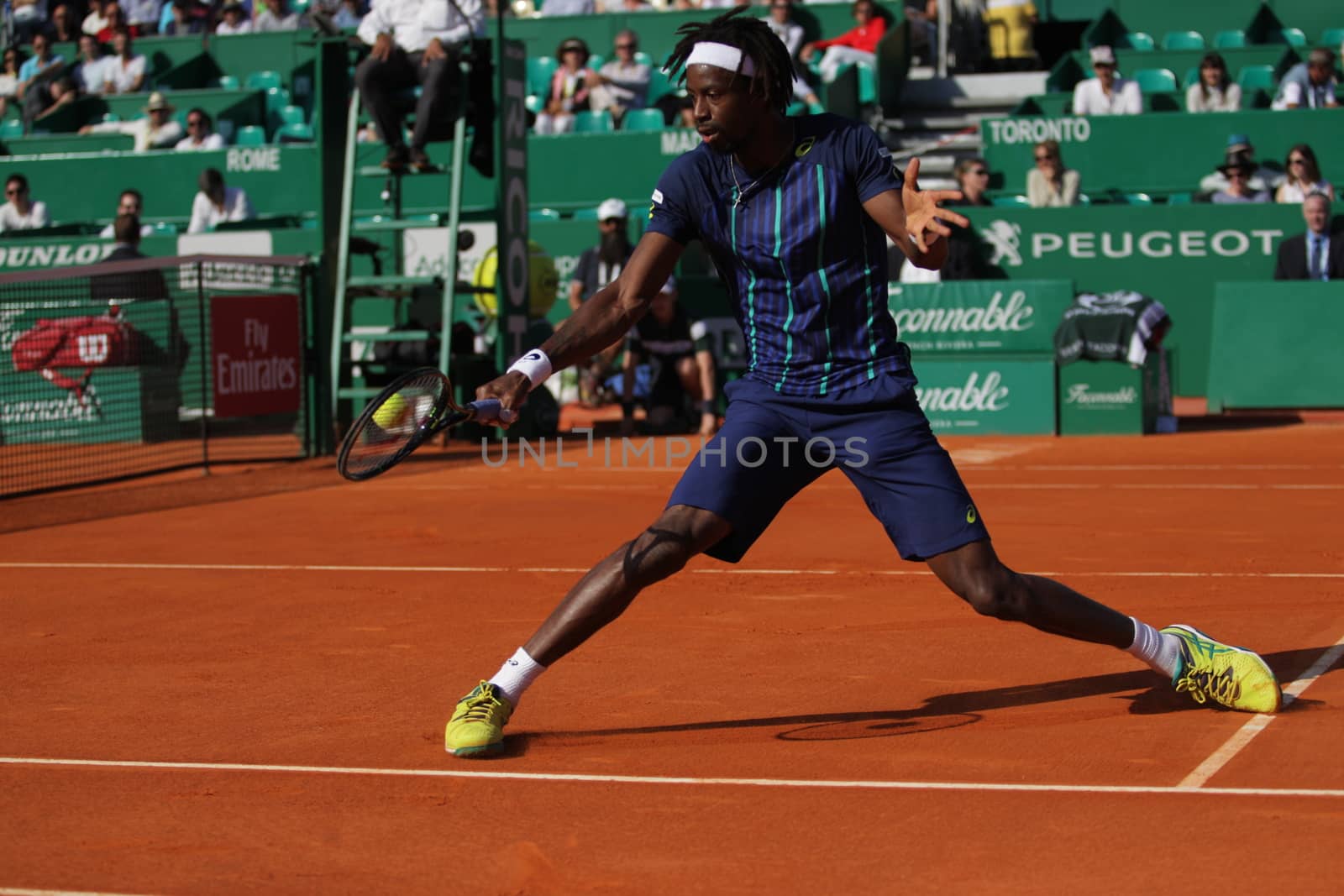 MONACO, Monte-Carlo : France's Gael Monfils hits a return to Spain's Marcel Granollers during the Monte-Carlo ATP Masters Series Tournament tennis match, on April 15, 2016 in Monaco. 