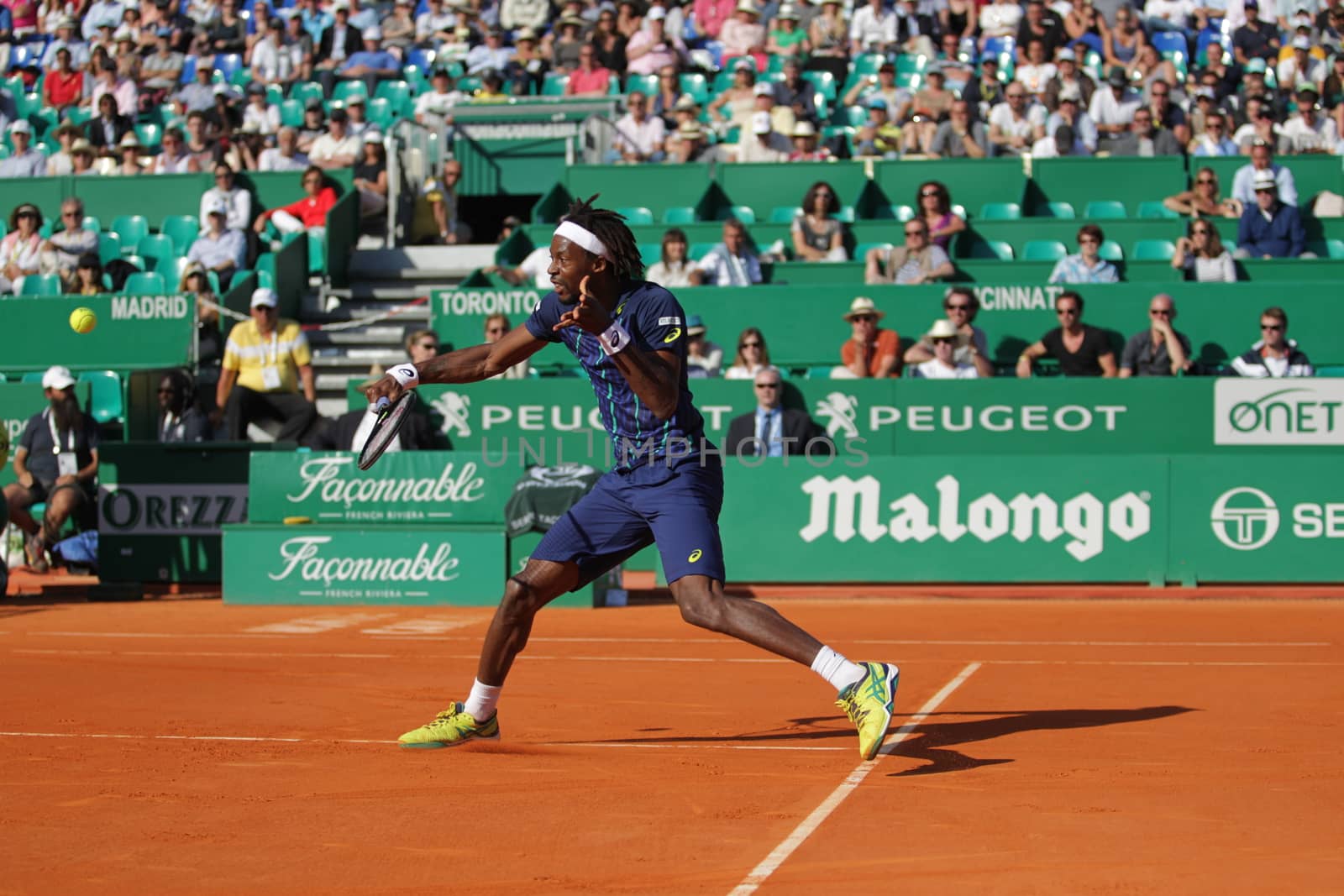 MONACO, Monte-Carlo : France's Gael Monfils hits a return to Spain's Marcel Granollers during the Monte-Carlo ATP Masters Series Tournament tennis match, on April 15, 2016 in Monaco. 