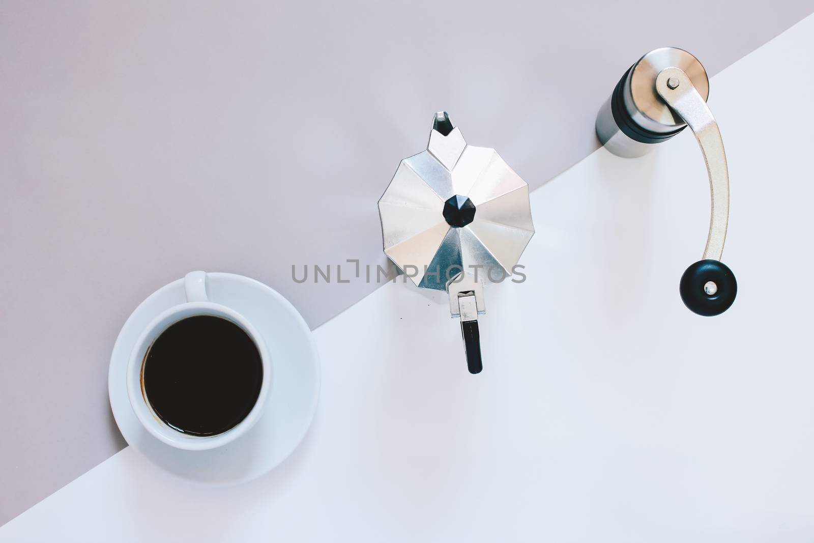 Creative flat lay photo of coffee workspace with coffee maker, coffee grinder and black coffee,  minimal style
