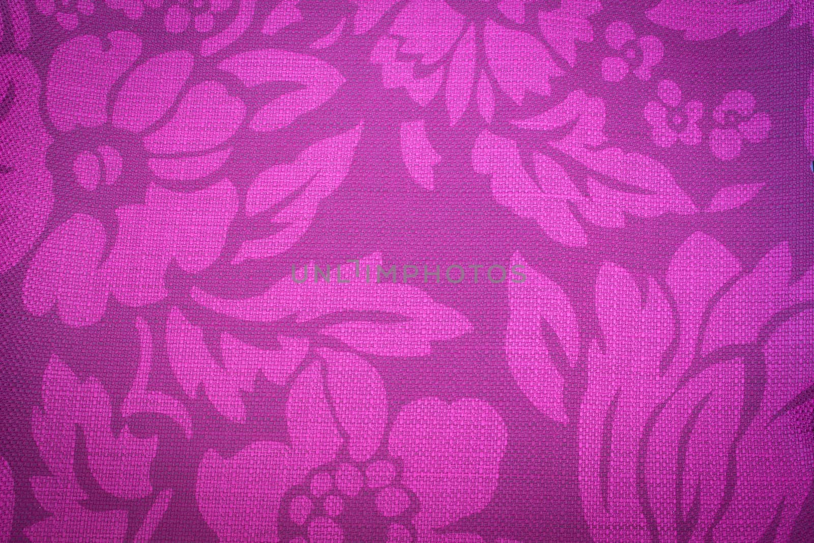 Rustic canvas fabric texture in purple color.