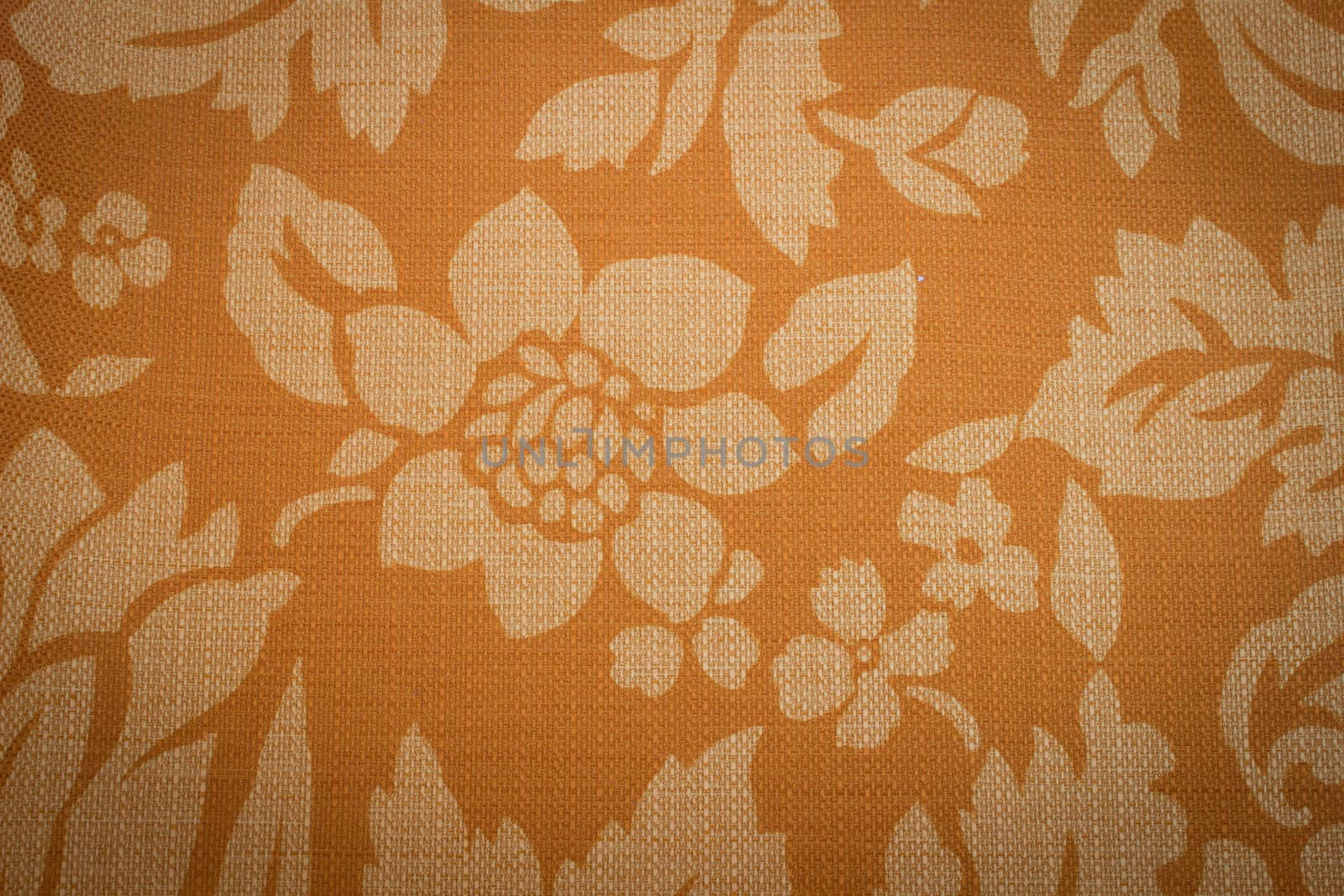 Rustic canvas fabric texture in orange color.