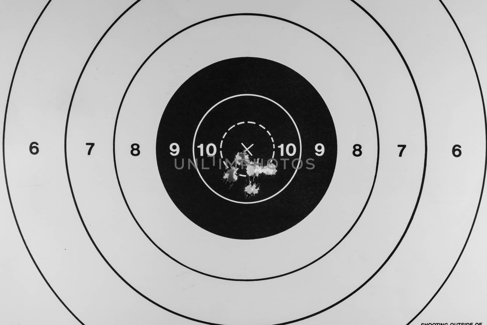 Nice tight grouping of five shots on a paper target