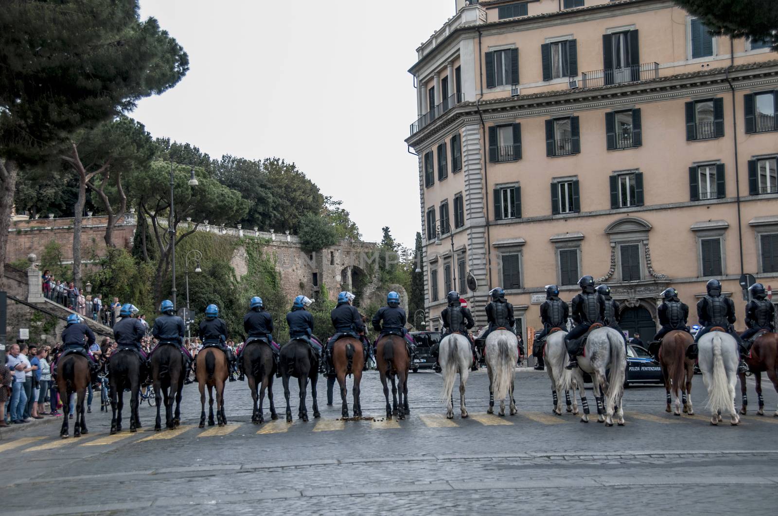 ITALY, Rome: Policemen face protesters during a demonstration, called by the Movements for the Right to Housing, to protest against forced housing evictions and to ask for the right to housing in Rome, Italy on April 16, 2016. Thousands of 'Housing Rights' activists took to the street in Rome to protest against forced housing evictions, to ask for the respect of accommodation right and use more public funds to help people without homes or those who cannot pay their rent.