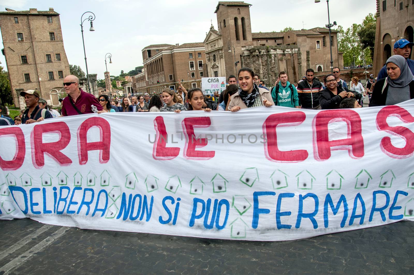 ITALY, Rome: Protesters hold a banner reading Now the house during a demonstration, called by the Movements for the Right to Housing, to protest against forced housing evictions and to ask for the right to housing in Rome, Italy on April 16, 2016. Thousands of 'Housing Rights' activists took to the street in Rome to protest against forced housing evictions, to ask for the respect of accommodation right and use more public funds to help people without homes or those who cannot pay their rent.