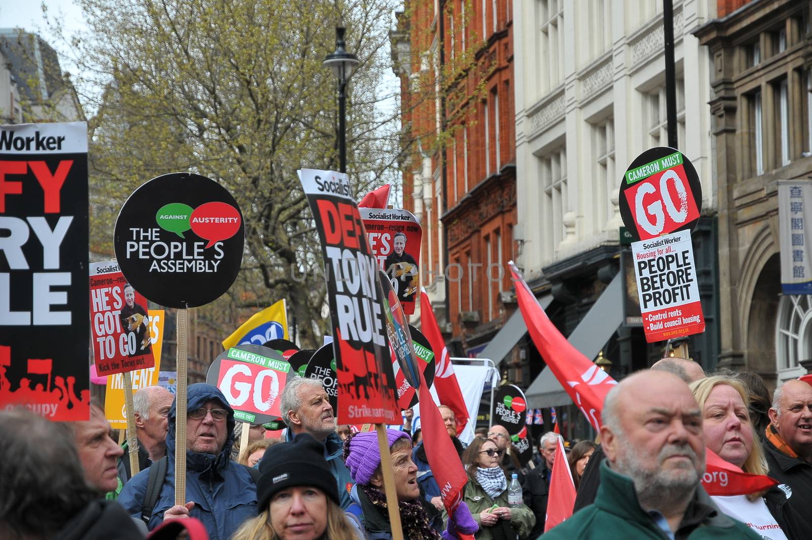 UNITED KINGDOM, London: Protesters hold banners as ten of thousands march and protest against the Tories government and demanded David Cameron's resignation in Trafalgar square in London on April 16, 2016. Protesters descended to London in hundreds of coaches from all over the UK to take part in this anti-austerity protest.