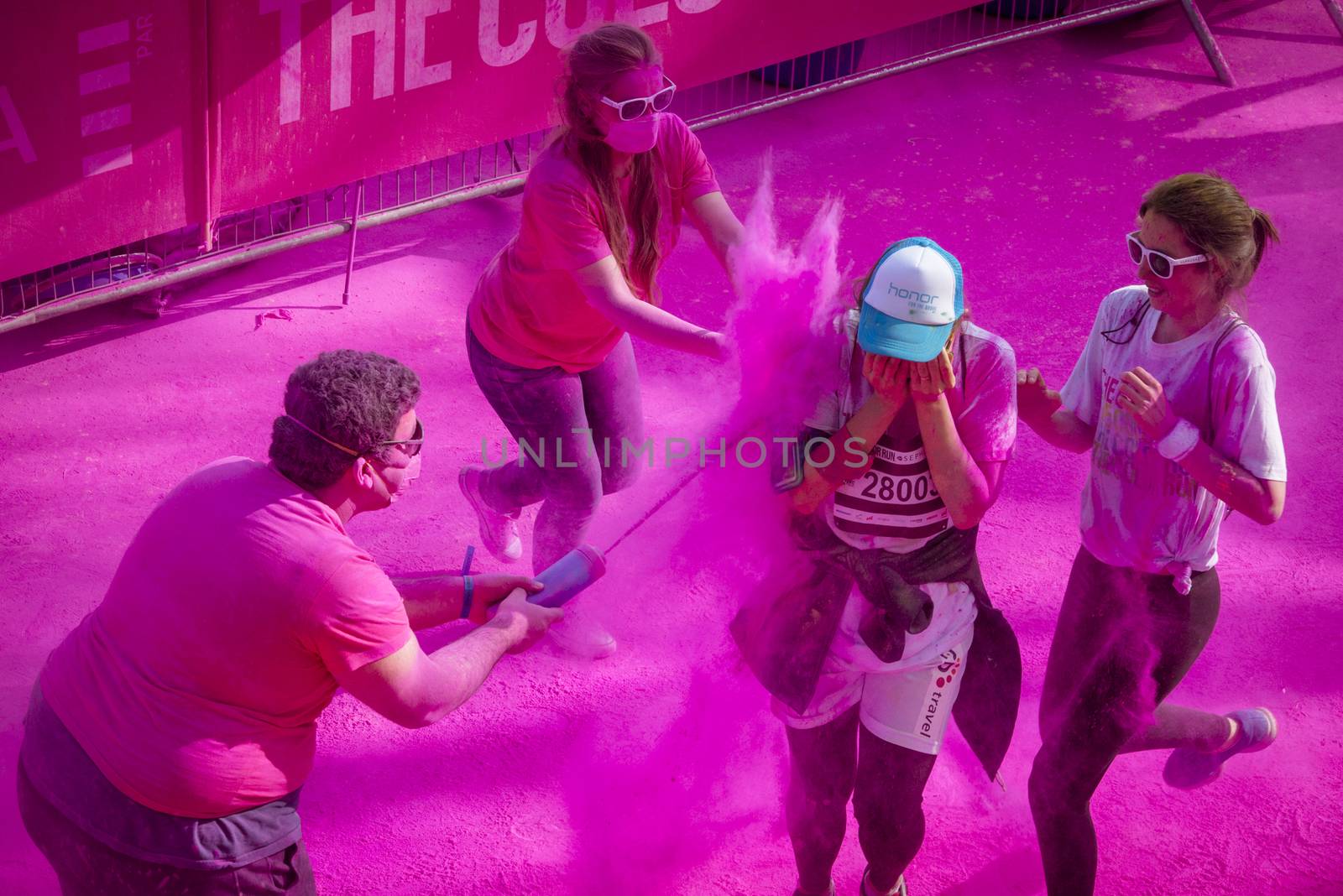 France: Volunteers throw colored pigments at participants of the Color Run by Sephora in Paris on April 17, 2016.