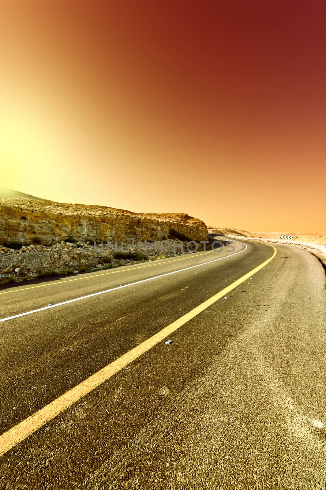 Asphalt Road in the Judean Desert on the West Bank at Sunset, Vintage Style Toned Picture 