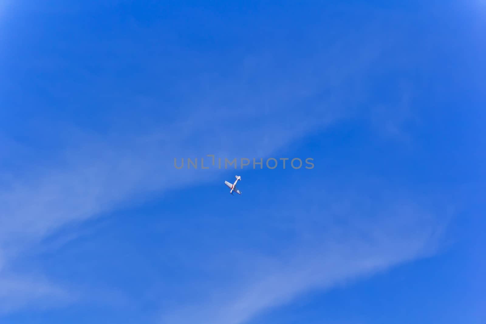 Photo of flying military plane in blue sky