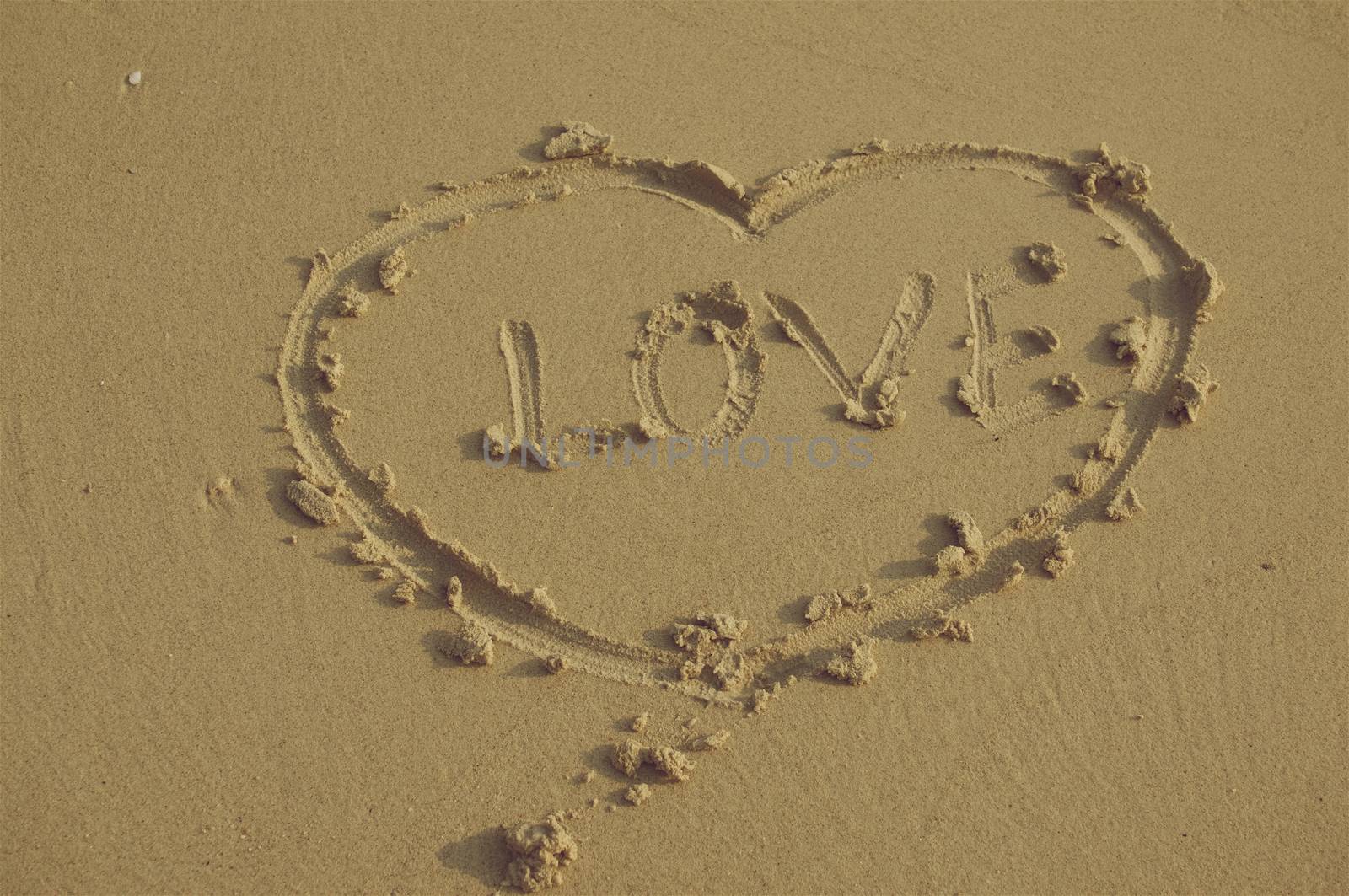 Heart sign and love on sand in vintage style by eaglesky