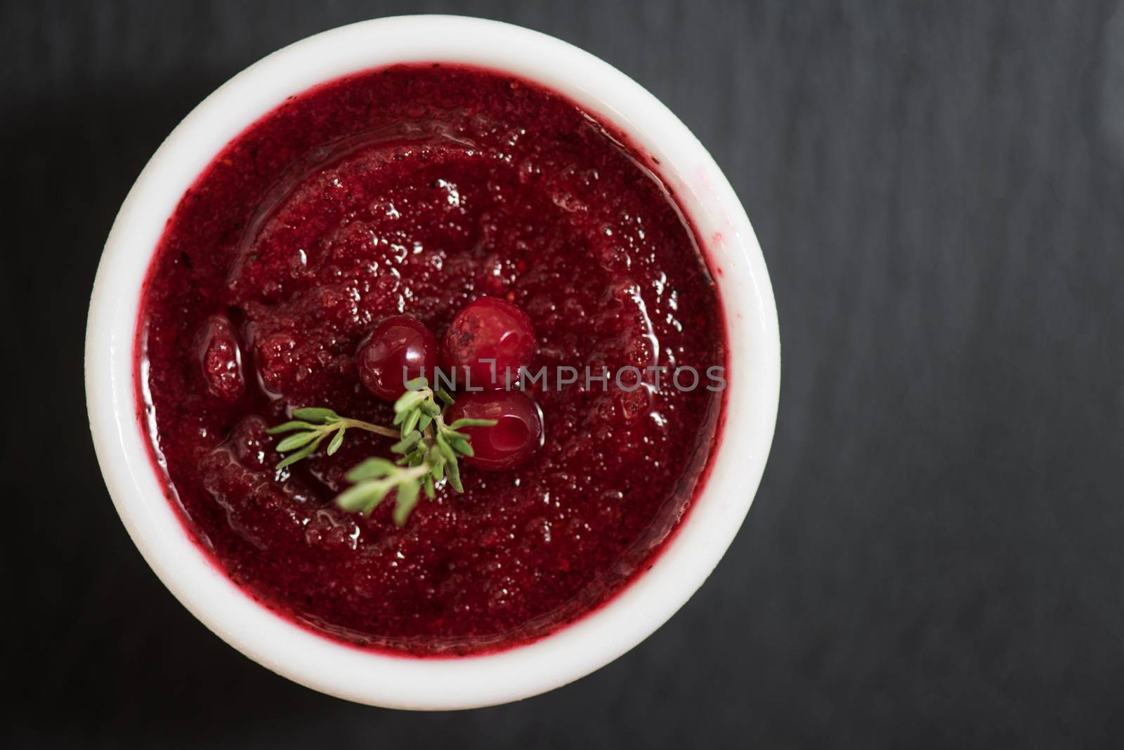 Refreshing cranberry sorbet at white bowl