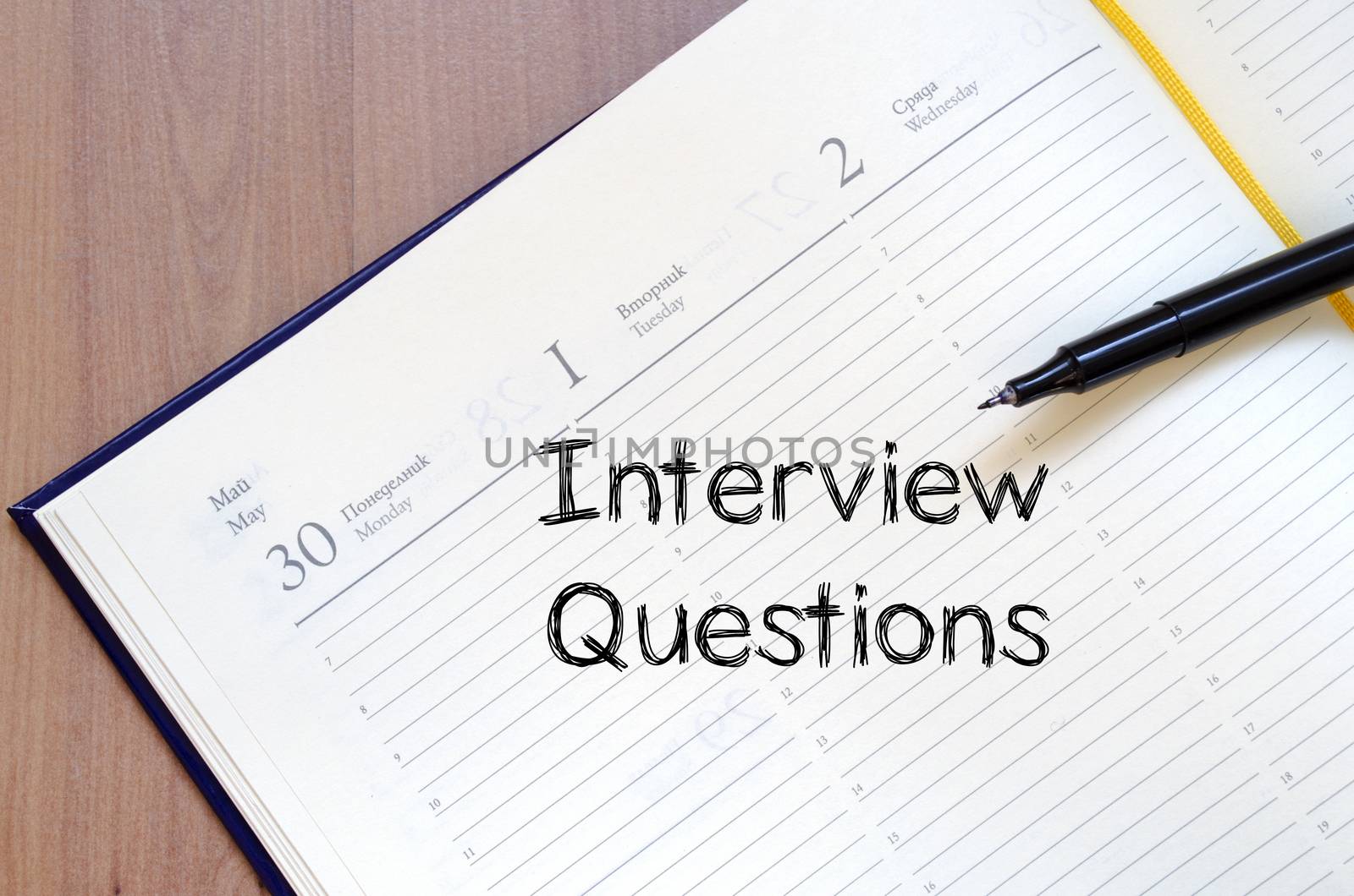 Interview questions text concept write on notebook