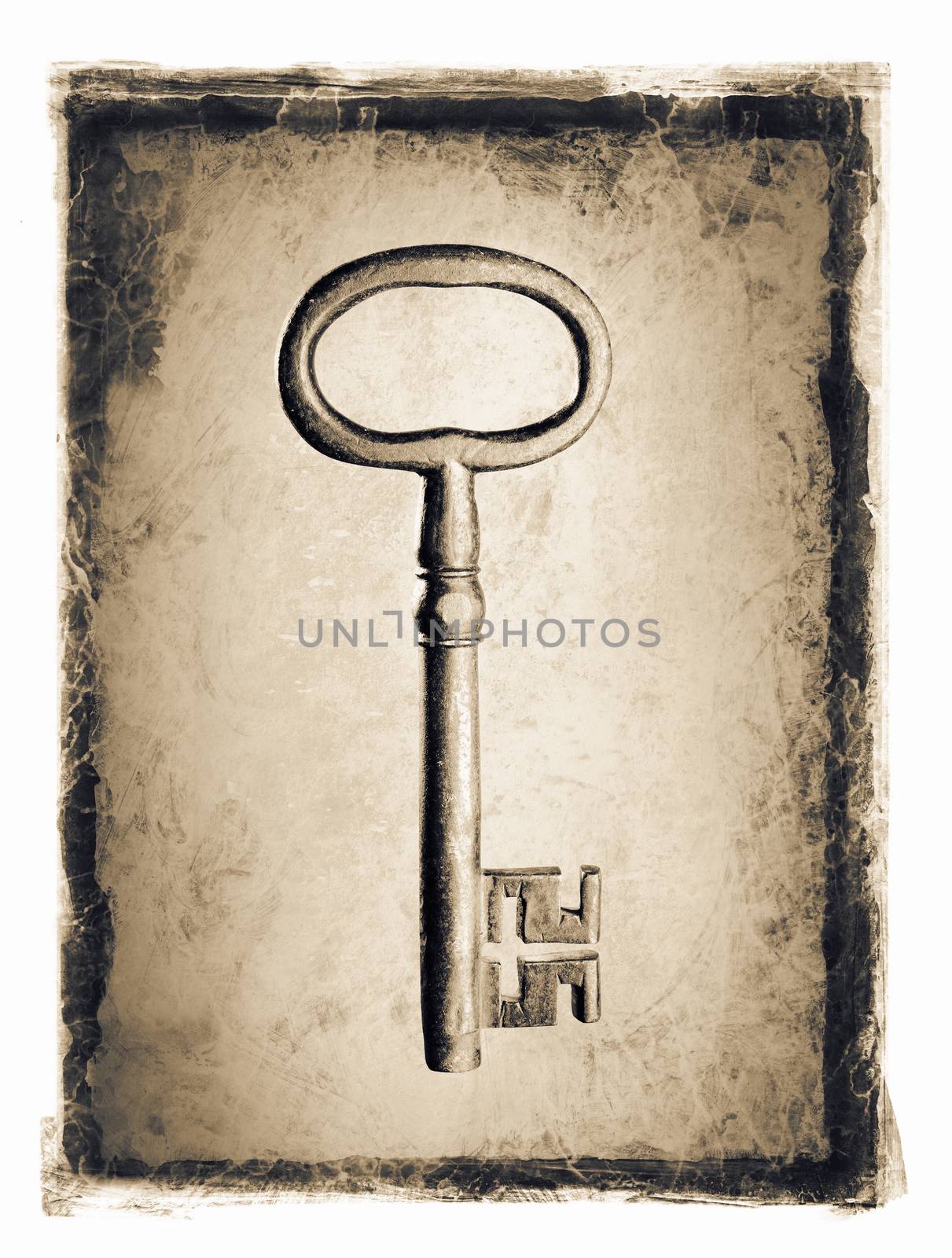 Old key ion a grunge distressed frame.