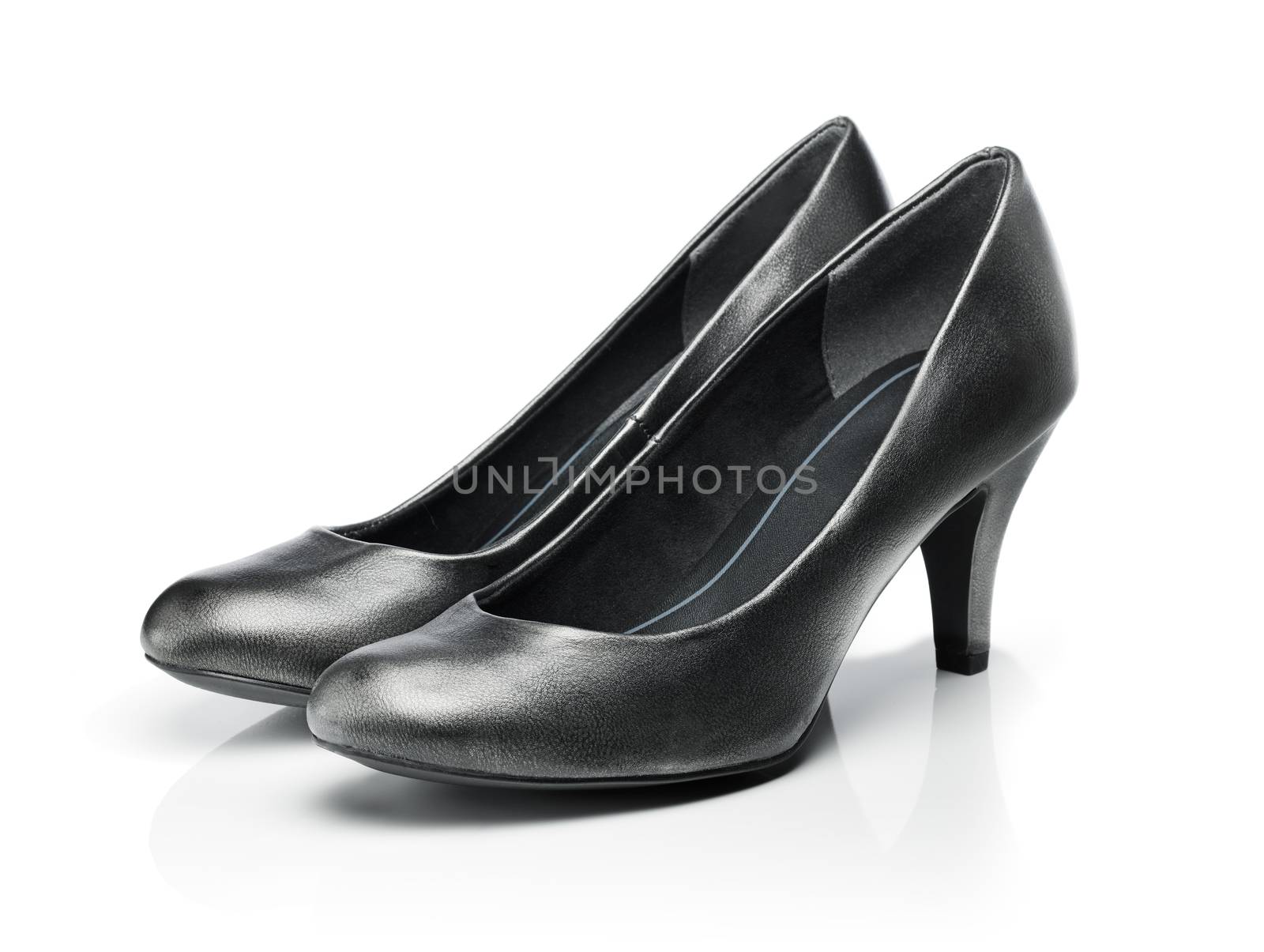 Pair of dark grey everyday pumps isolated on white with reflection.