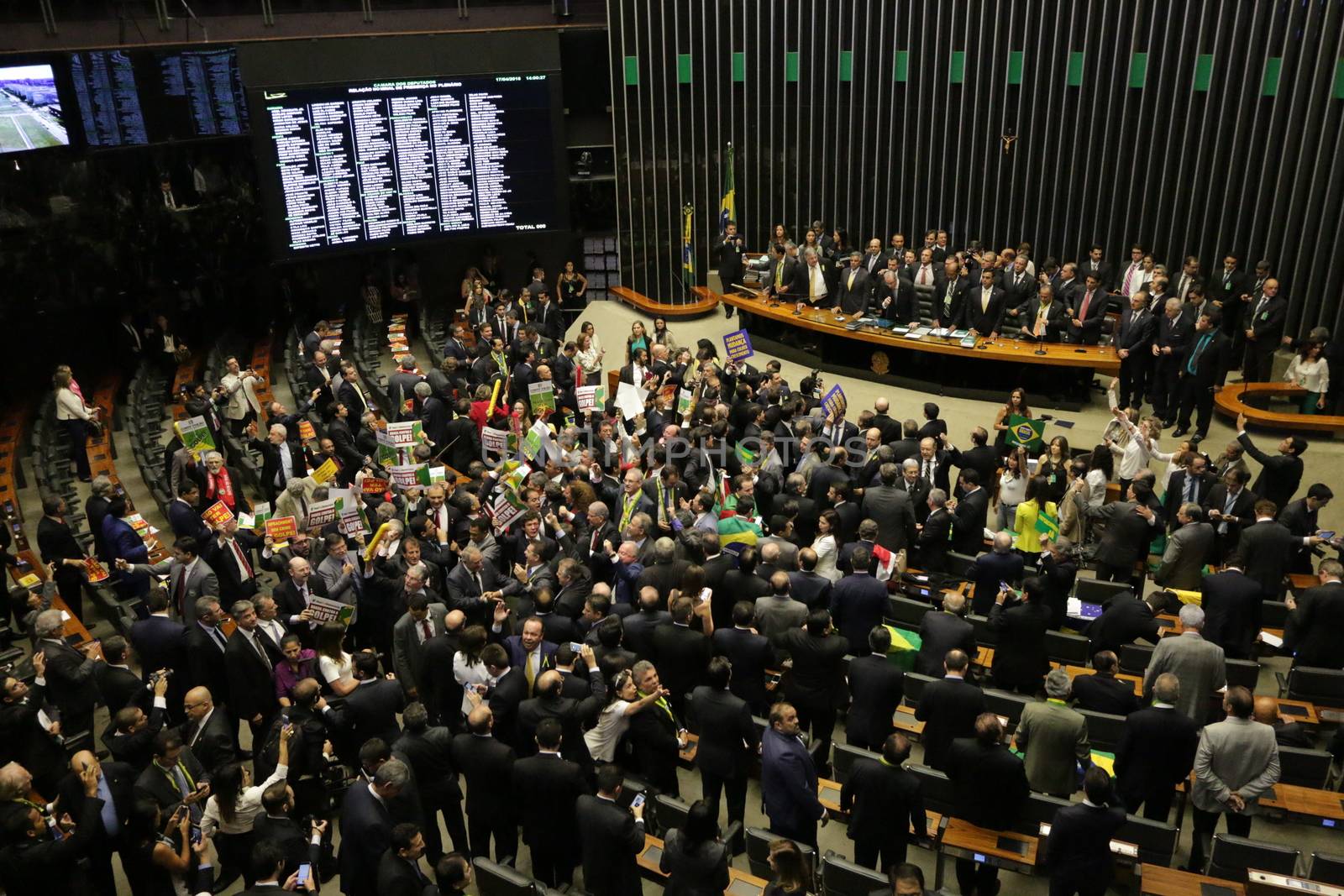 BRAZIL, Brasilia: Members of parliament began impeachment proceedings for President Dilma Rousseff on April 17, 2016 in Brasilia. Some members of parliament began signing, shouting and throwing confetti as the proceedings turned chaotic. The impeachment issue has divided Brazil over the past few weeks with some in support of impeaching Rousseff, while others are strongly opposed. Brazil's lower house is voting on whether to continue impeachment proceedings. 342 out of 513 votes are needed to continue the proceedings to the upper house.