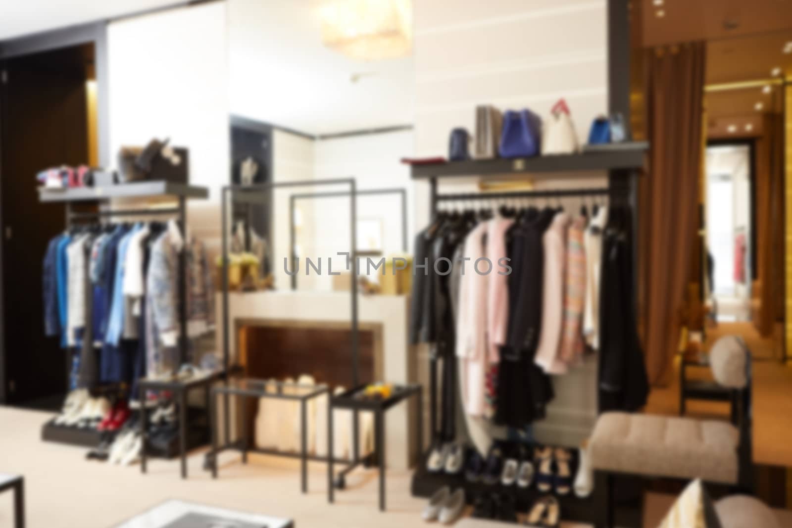 The blurred luxury clothing boutique interior background