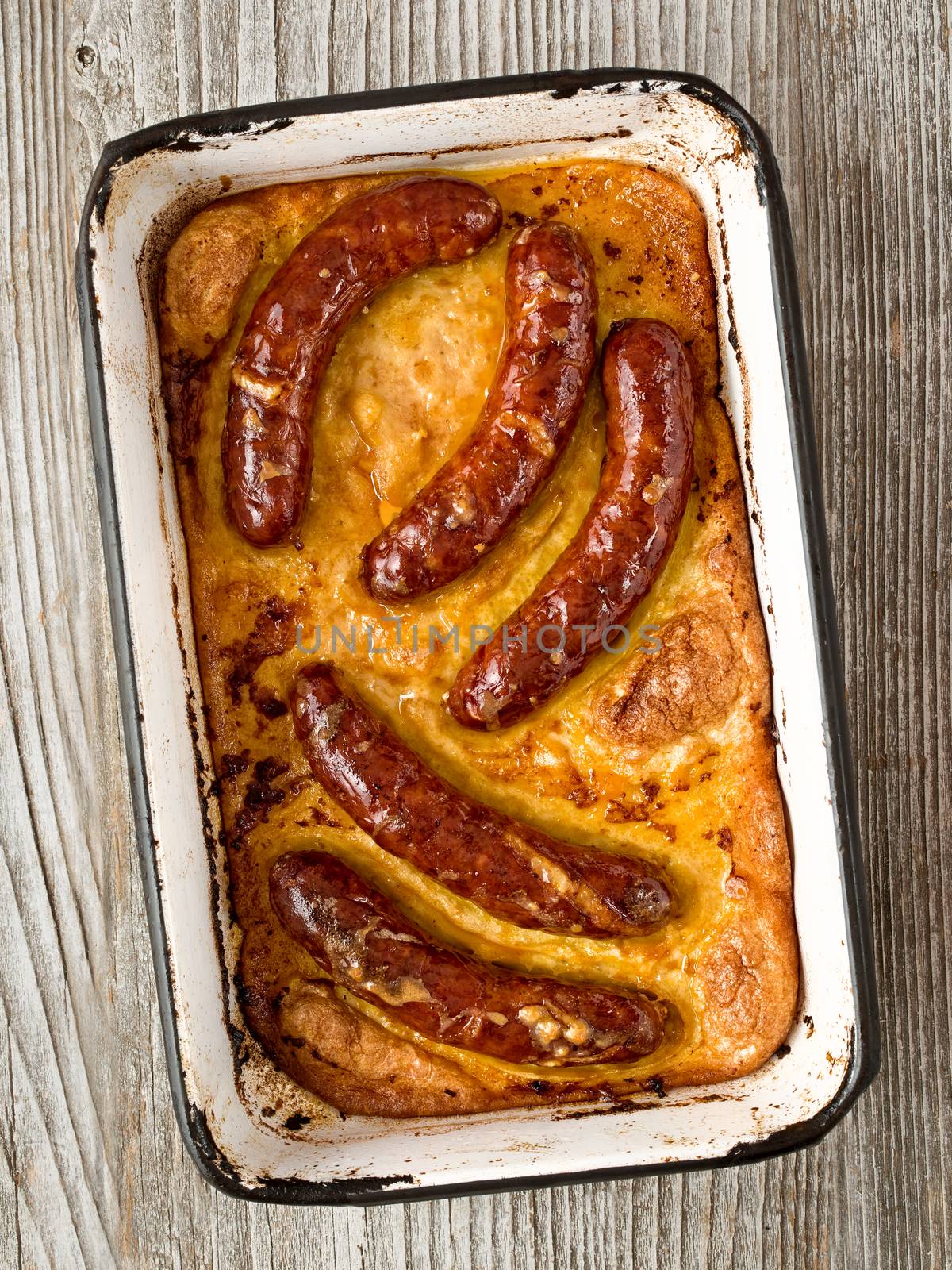 close up of rustic english pub grub toad in the hole