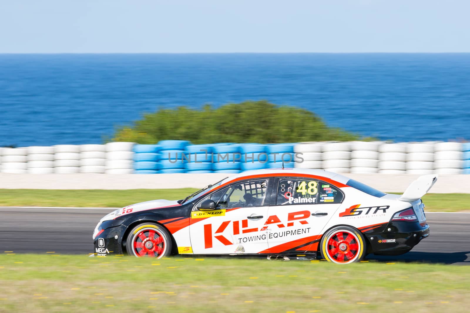 PHILLIP ISLAND, MELBOURNE/AUSTRALIA - 17 APRIL 2016: Dunlop Series race cars exiting turn 6 at Phillip Island.