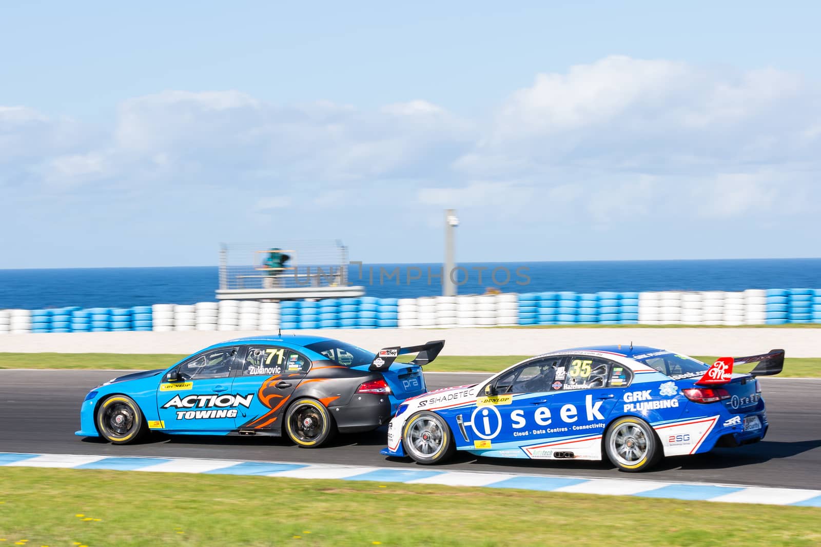 PHILLIP ISLAND, MELBOURNE/AUSTRALIA - 17 APRIL 2016: Dunlop Series race cars exiting turn 6 at Phillip Island.