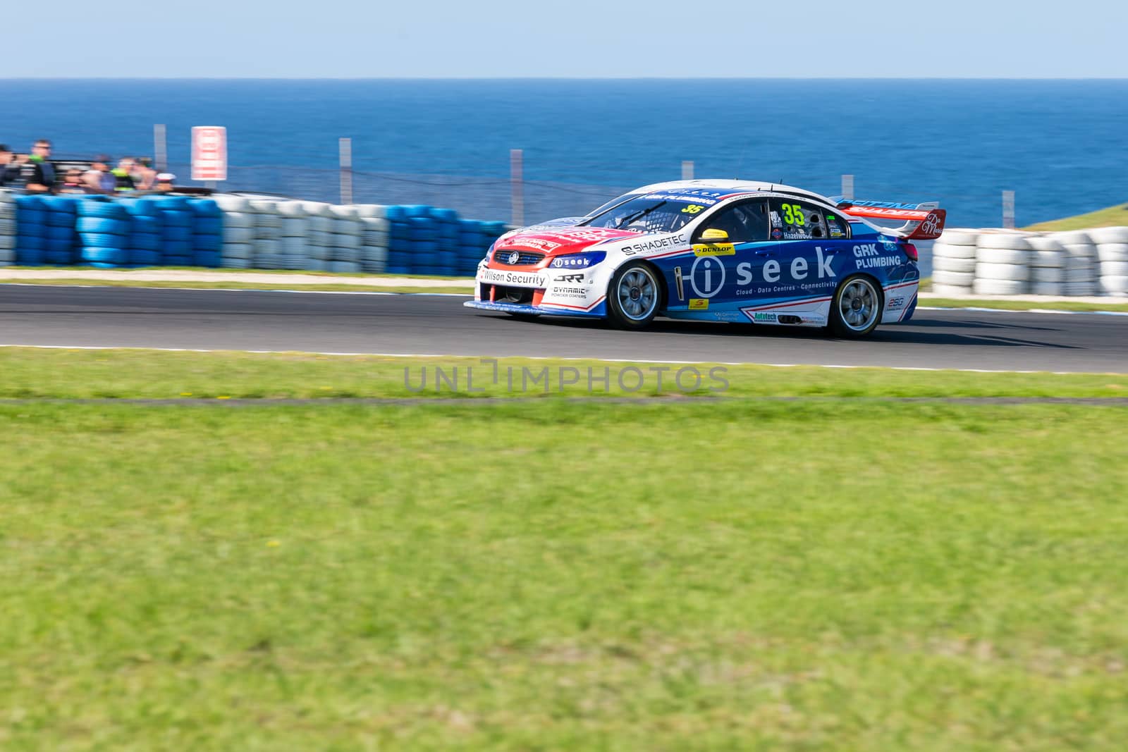 PHILLIP ISLAND, MELBOURNE/AUSTRALIA - 17 APRIL 2016: Dunlop Series race cars exiting turn 6 at Phillip Island.