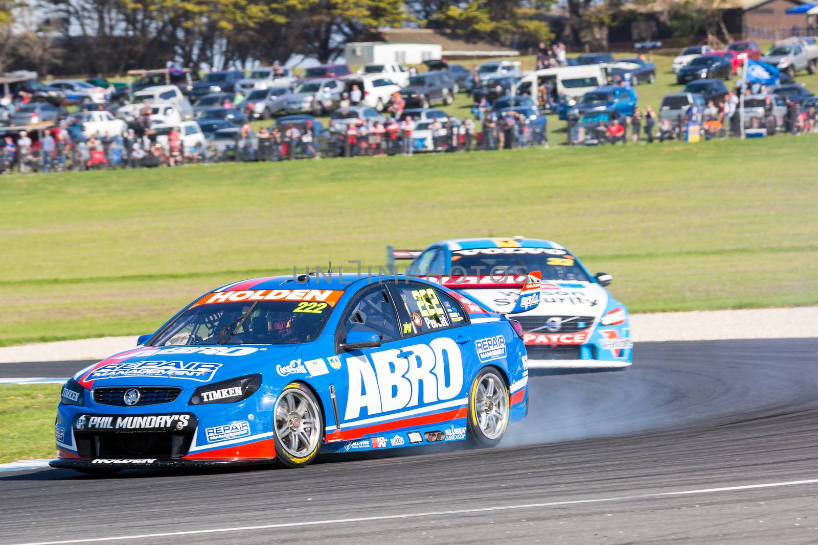 PHILLIP ISLAND, MELBOURNE/AUSTRALIA - 17 APRIL 2016: Nick Percat's Holden Commodore suffers mechanical damage as it exits turn 4 at Phillip Island.