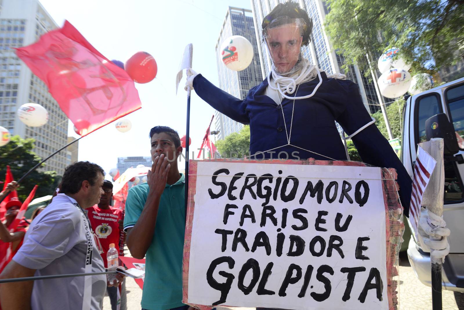 BRAZIL, Sao Paulo: An effigy of judge Sergio Moro depicting him as a traitor is seen as supporters of Brazilian President Dilma Rousseff follow on big screens in Sao Paulo, the voting of lawmakers at the Congress in Brasilia on whether the impeachment of Rousseff will move forward, on April 17, 2016. The voting followed a raucous debate that transfixed the deeply divided nation. The opposition needs a total of 342 out of the 513 deputies in the lower house of Congress to authorize the trial. Rousseff, whose approval rating has plunged to a dismal 10 percent, faces charges of embellishing public accounts to mask the budget deficit during her 2014 reelection.