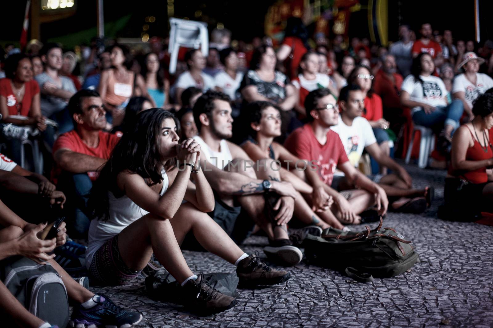 BRAZIL, Curitiba: Activists supporting Brazilian President Dilma Rousseff follow on a big screen as lawmakers vote on whether the impeachment of Rousseff will move forward, in Curitiba, southern Brazil, on April 17, 2016. Brazilian lawmakers on Sunday reached the two thirds majority necessary to authorize impeachment proceedings against President Dilma Rousseff. The lower house vote sends Rousseff's case to the Senate, which can vote to open a trial. A two thirds majority in the upper house would eject her from office. Rousseff, whose approval rating has plunged to a dismal 10 percent, faces charges of embellishing public accounts to mask the budget deficit during her 2014 reelection.