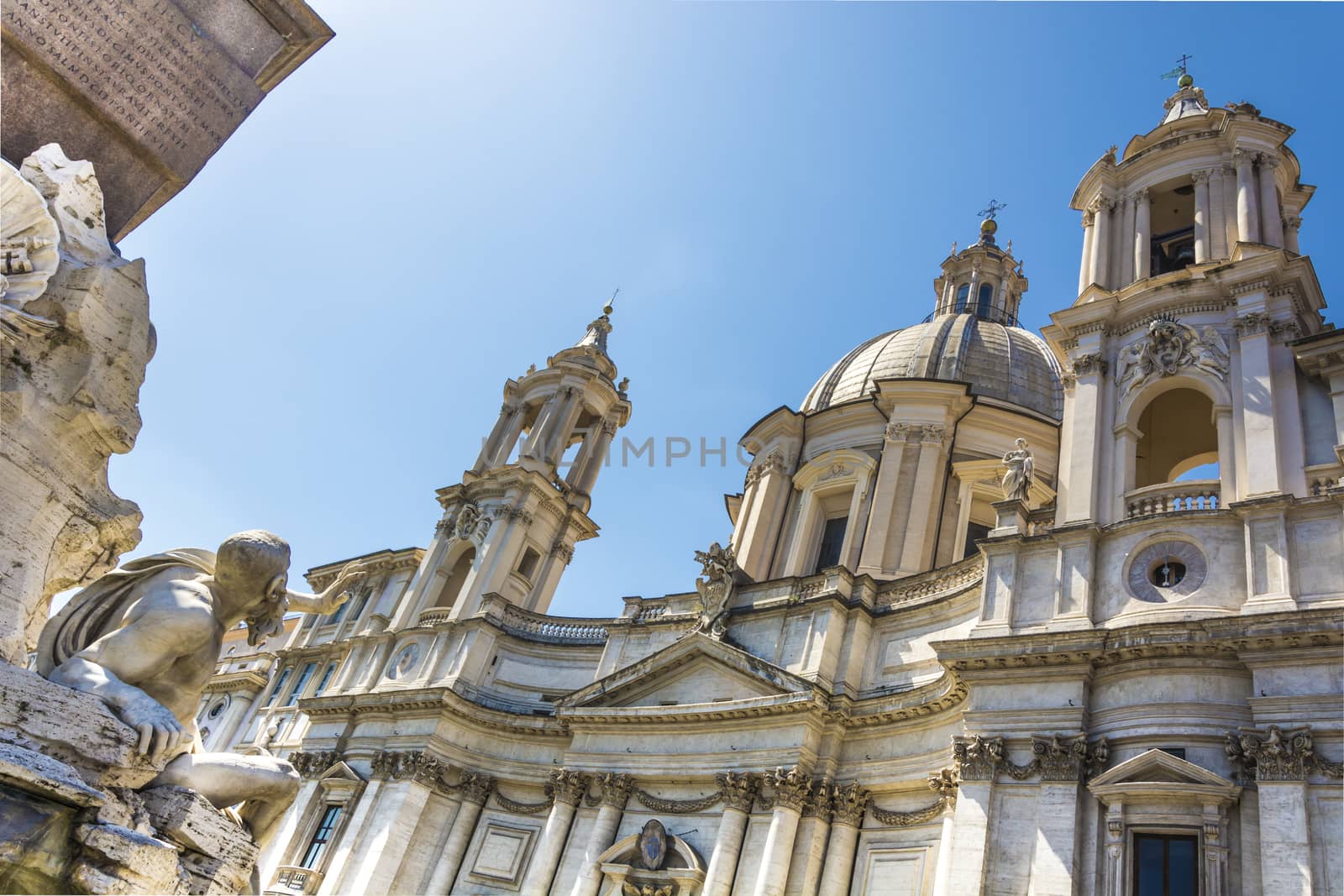 details of two roman baroque masterpiece: the four river fountain andhe the saint Agnese church in Piazza Navona in Rome