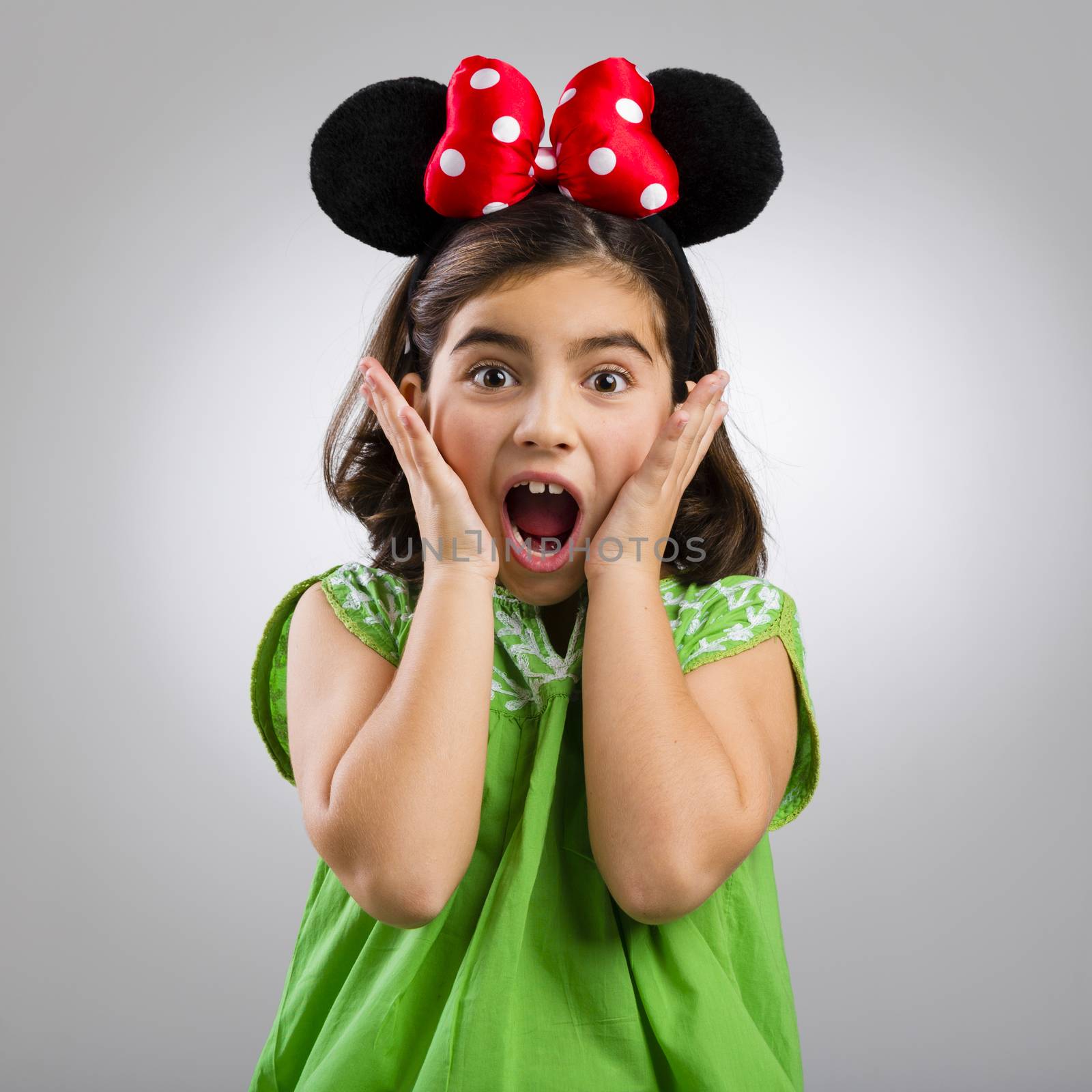 Studio portrait of a little girl with mouse ears