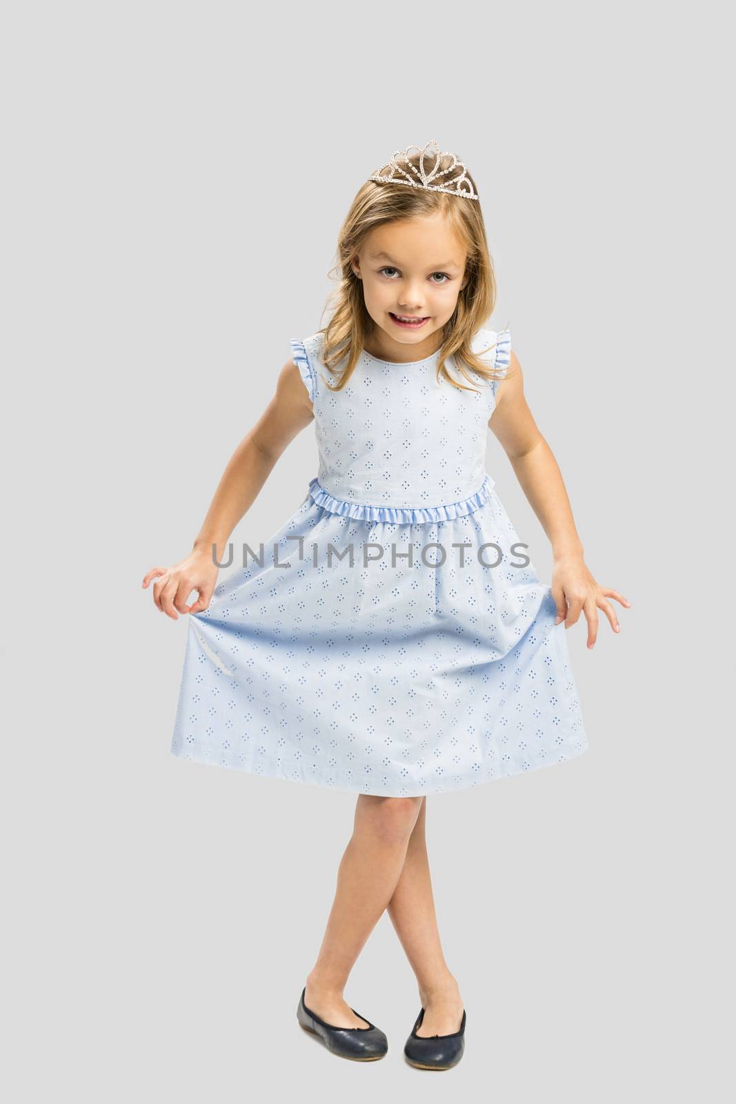 Portrait of a cute happy little girl wearing a princess crown