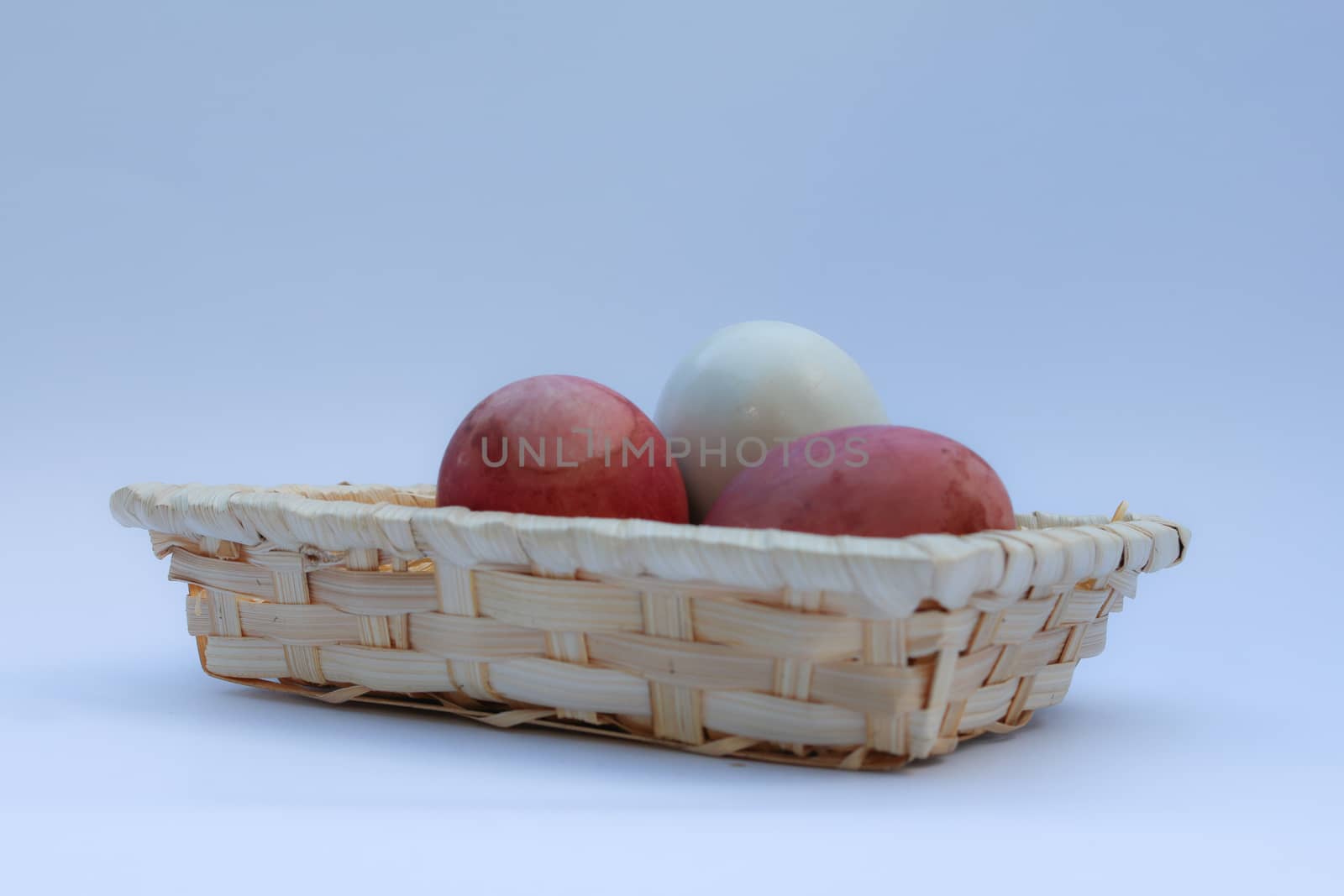 egg in basket wicker on white background