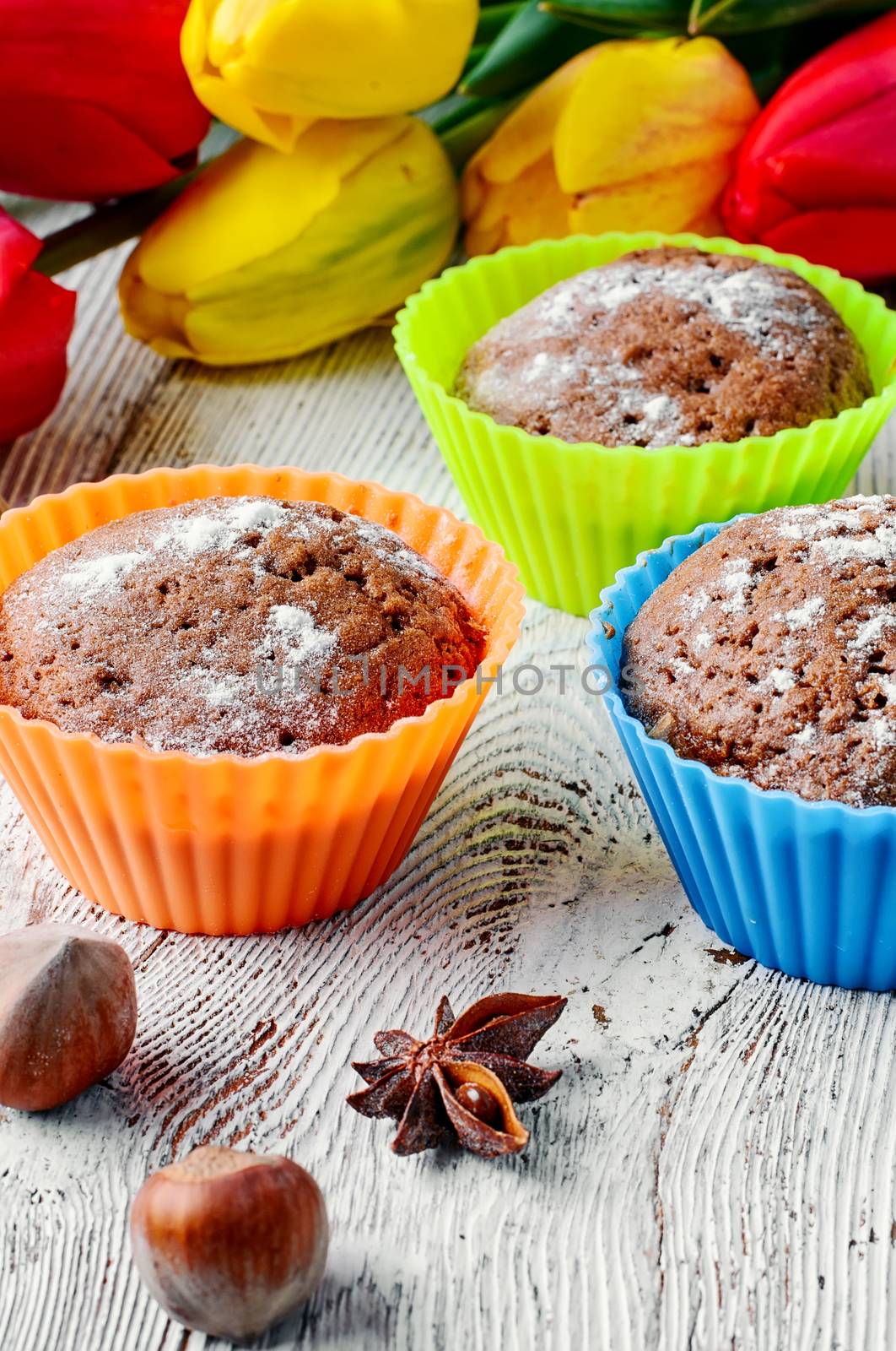 Sweet muffin tins and bouquet of fresh cut tulips