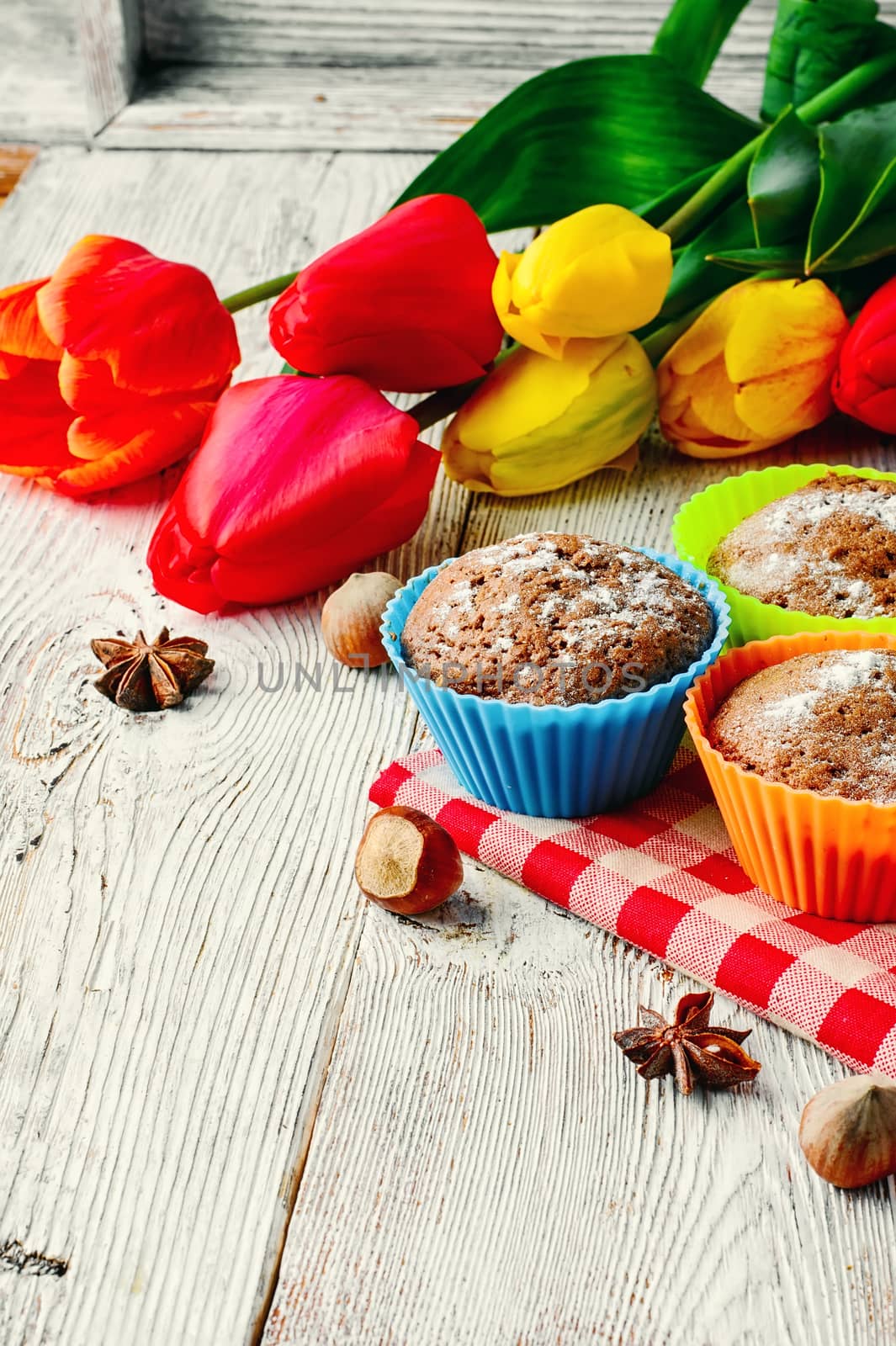 Sweet muffin tins and bouquet of fresh cut tulips
