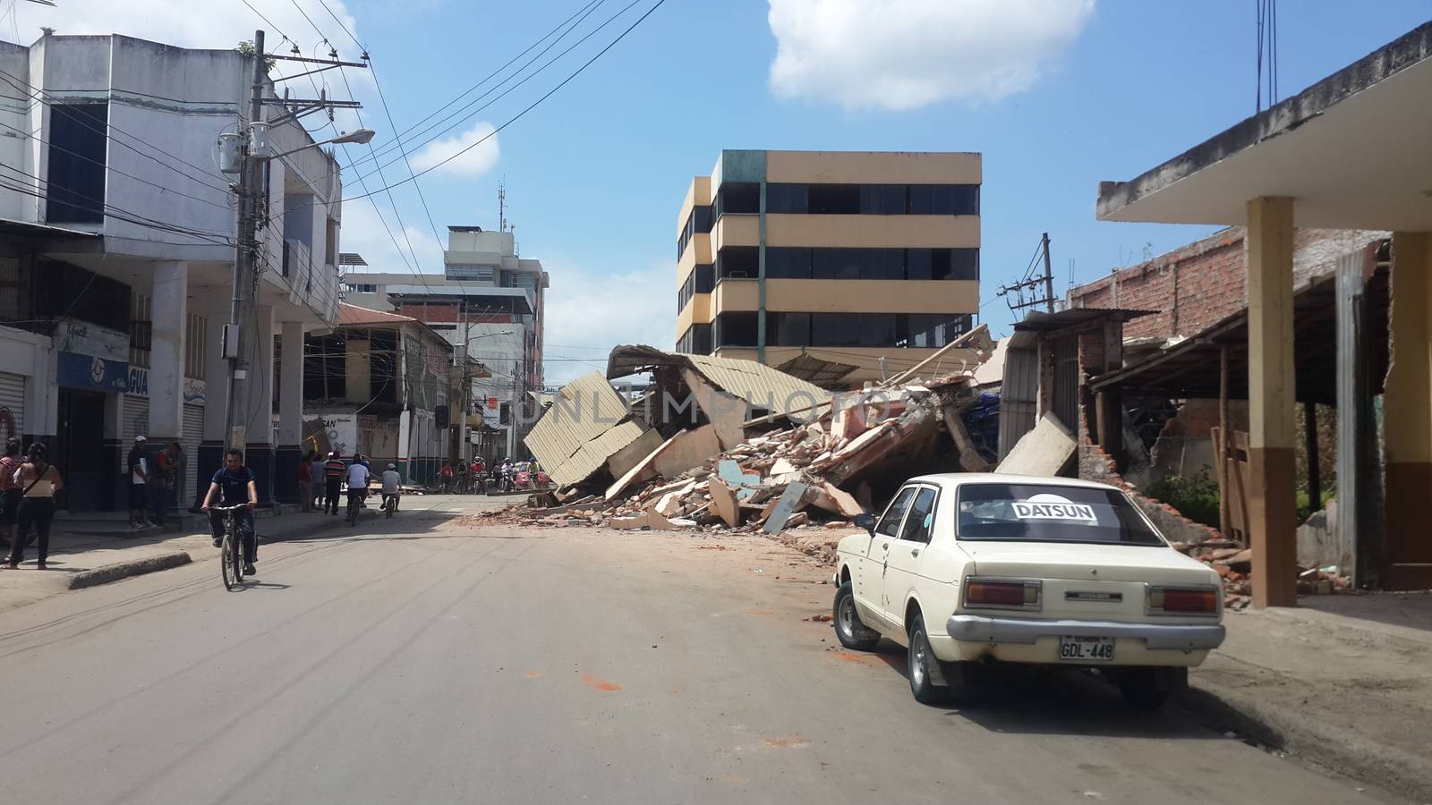 ECUADOR, Portoviejo: A building in Portoviejo, Ecuador has collapsed on April 17, 2016 the day after a devastating earthquake killed roughly 350 people, and counting. In Portoviejo, a prison was reportedly destroyed, allowing 100 inmates to escape. A state of emergency has been declared, and more than 13,000 soldiers and police officers have been deployed to the worst-hit areas of the country.