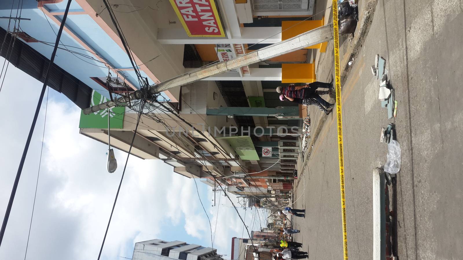 ECUADOR, Portoviejo: An electrical pole in Portoviejo, Ecuador has fallen on April 17, 2016 the day after a devastating earthquake killed roughly 350 people, and counting. In Portoviejo, a prison was reportedly destroyed, allowing 100 inmates to escape. A state of emergency has been declared, and more than 13,000 soldiers and police officers have been deployed to the worst-hit areas of the country.