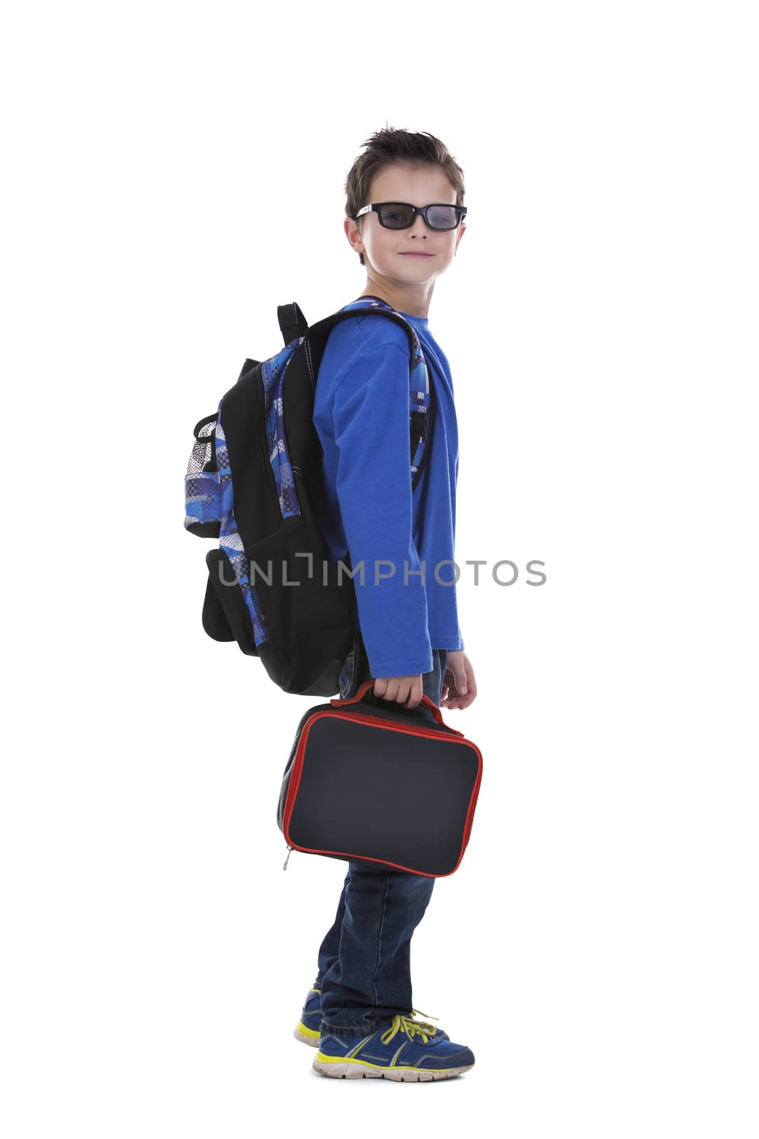 casual boy is holding an apple and school lunch on white background