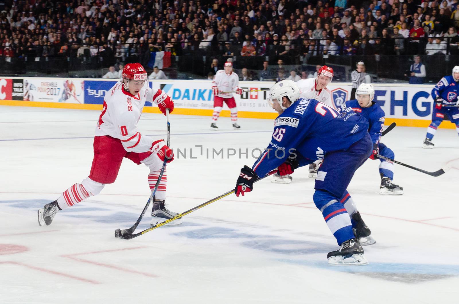 FRANCE, Paris: Danemark's Mathias From (L) in action is challenged by French defender Benjamin Dieude-Fauvel during a friendly match between France and Denmark at the AccorHotels Arena, in Paris, on April 17, 2016. Denmark won 2-1.