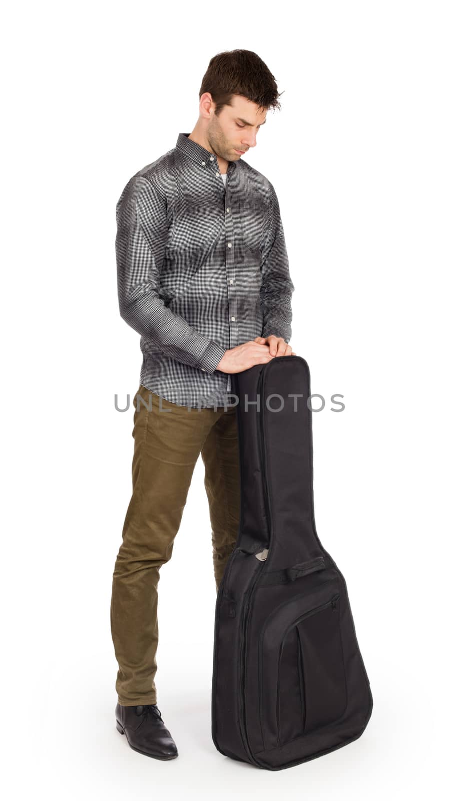 Musican with acoustic guitar in bag isolated on white