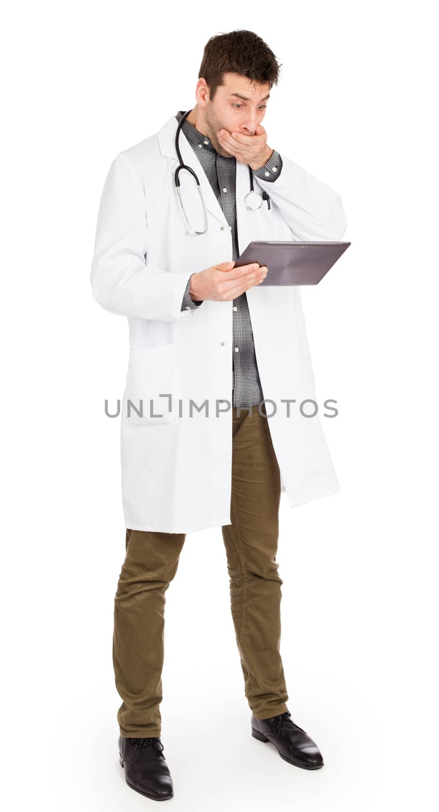 Male Caucasian doctor holding a digital tablet, looking shocked - Isolated on white